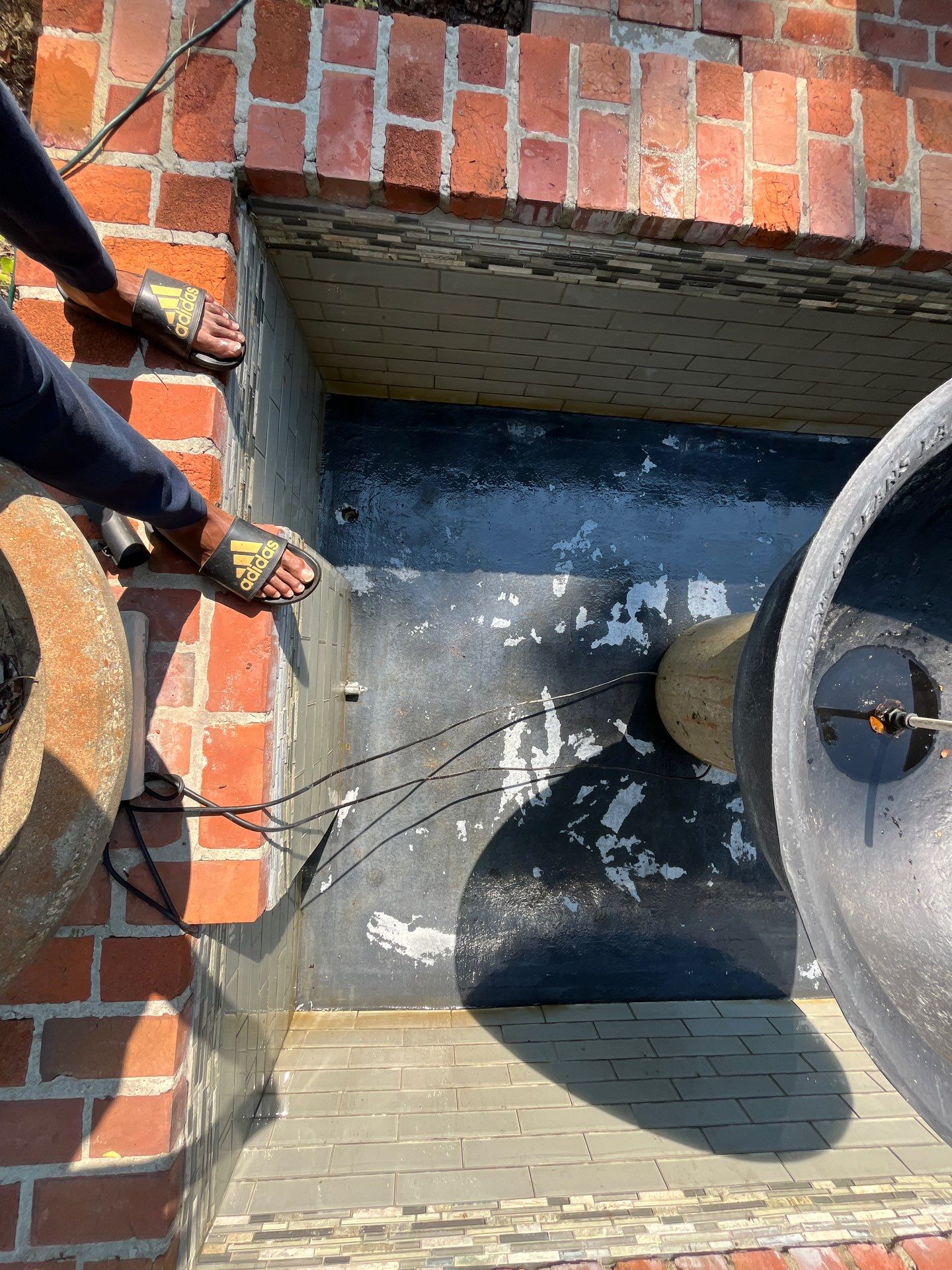 Pool Cleaning using Pool Cleaner by College Bros Outdoor services