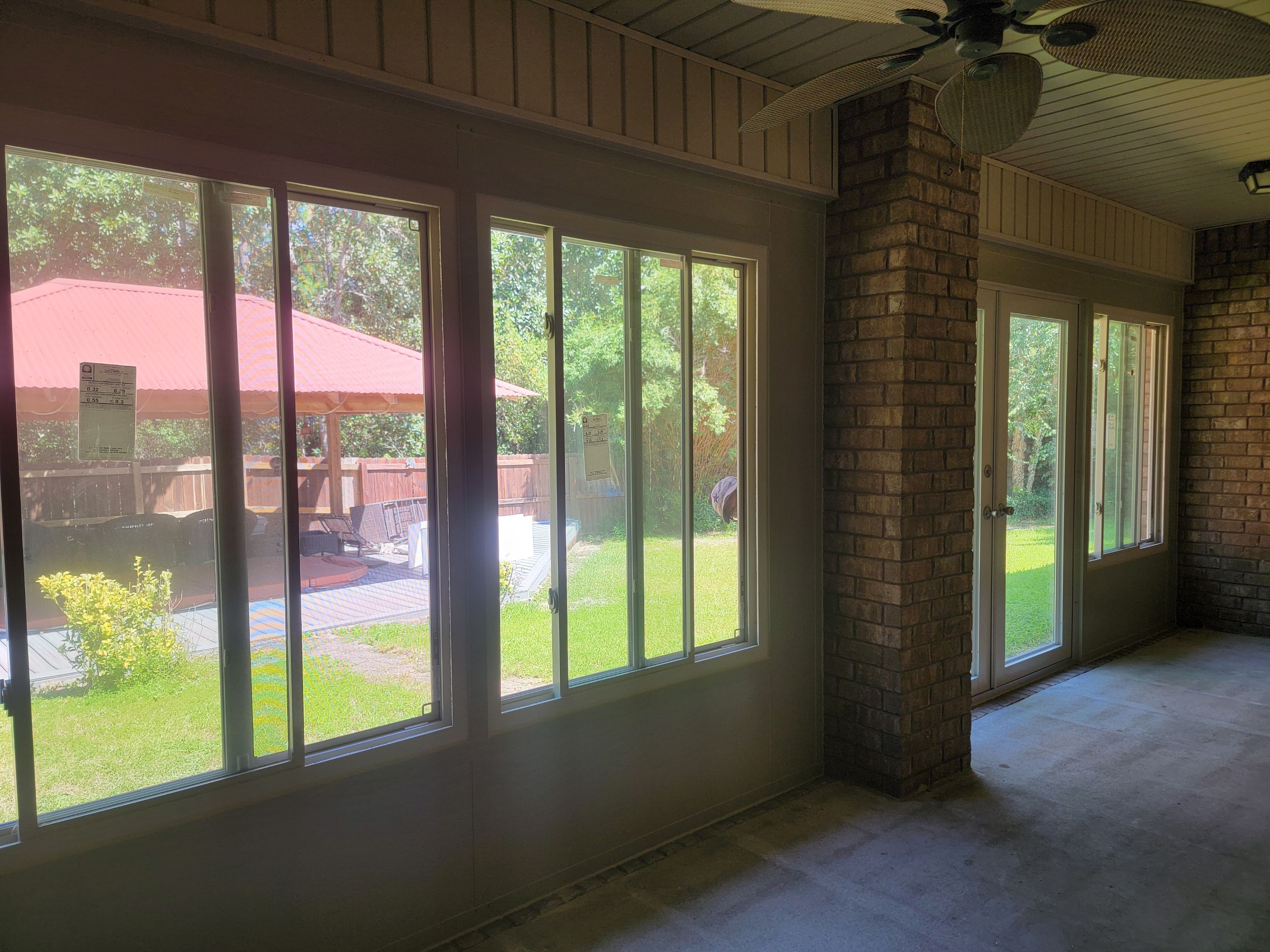 Glass Sunroom Constructed Under Existing Roof by Titan Sunrooms