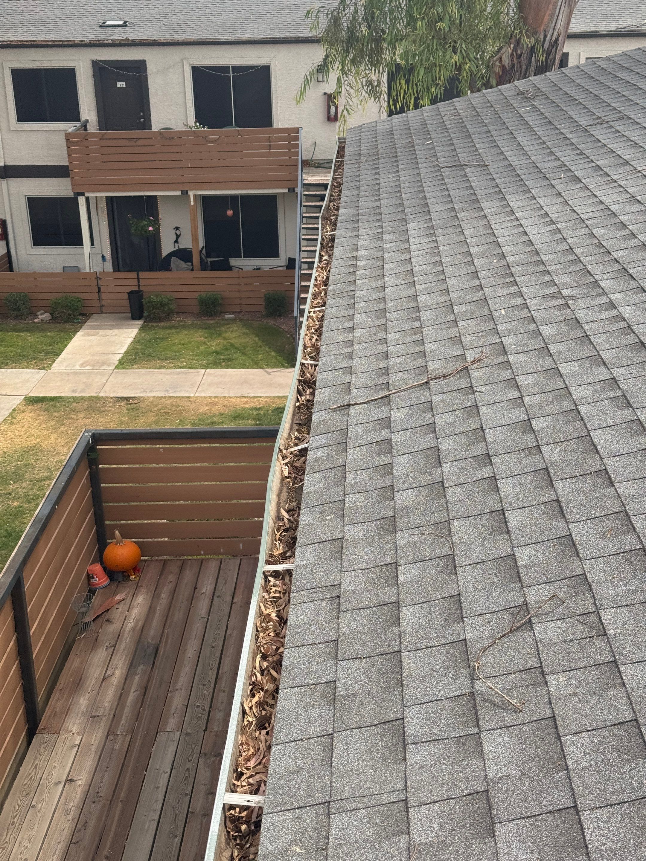 Commercial gutter cleaning Phoenix before photo with filled gutters