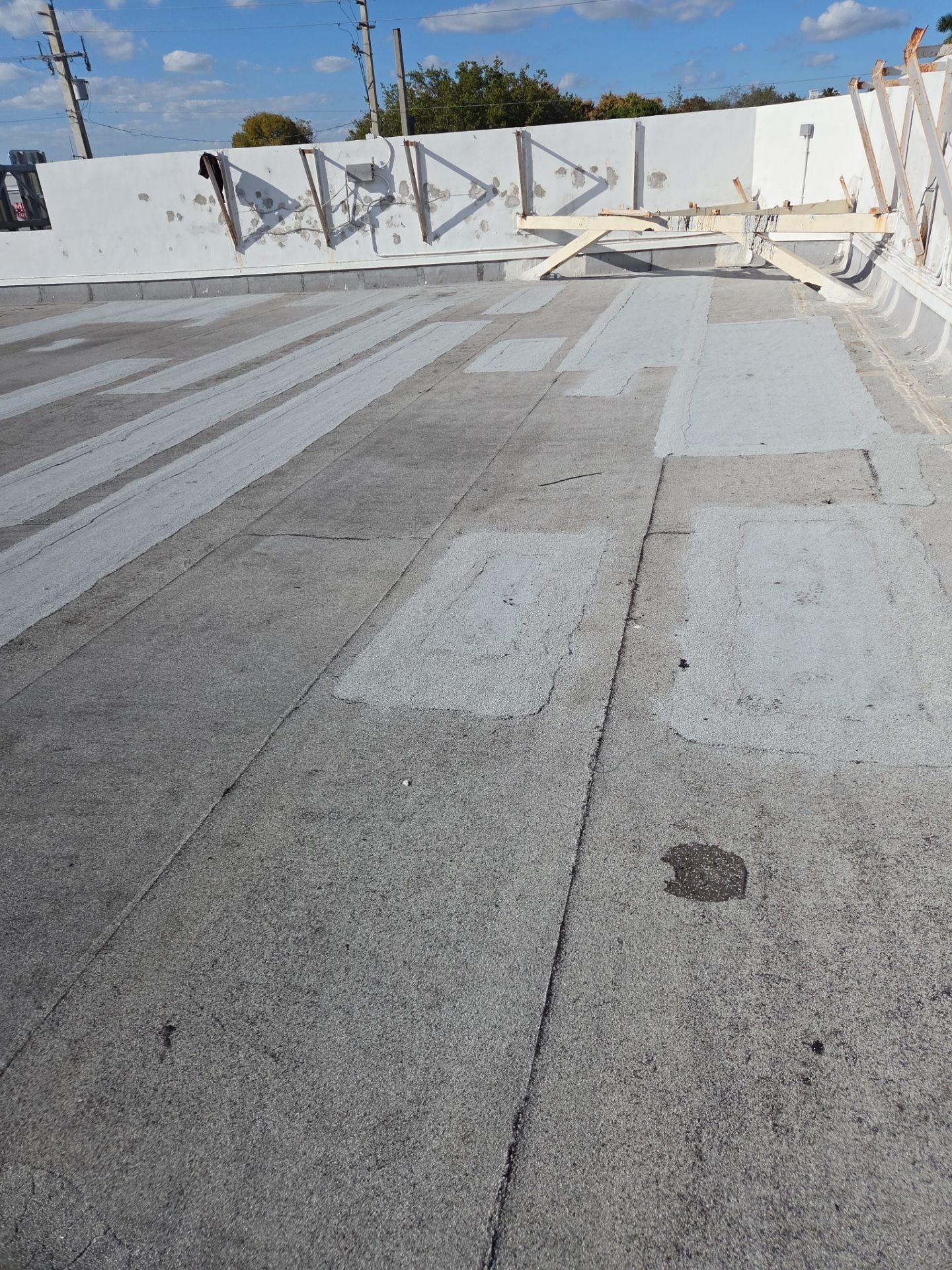 Commercial Flat Roof Restoration Using Silicone Coating in Hallandale Beach by Aastro Roofing