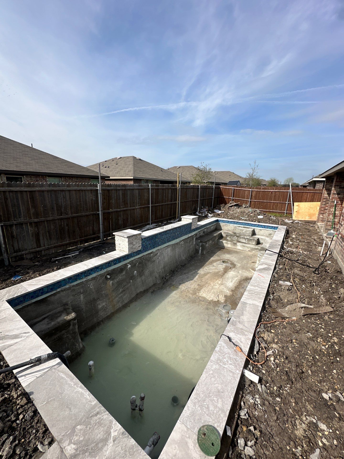 Geometric Pool with Raised Fountain Wall by Pinnacle Pools and Spas - DFW