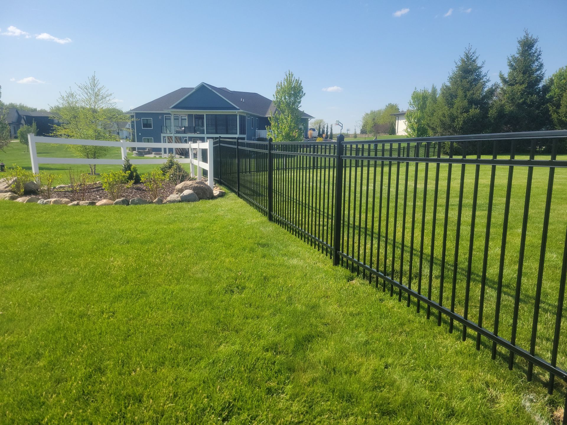 Black Ornamental Metal Picket Fence Installation in Waterloo by Perfect Picket Fence and Stain