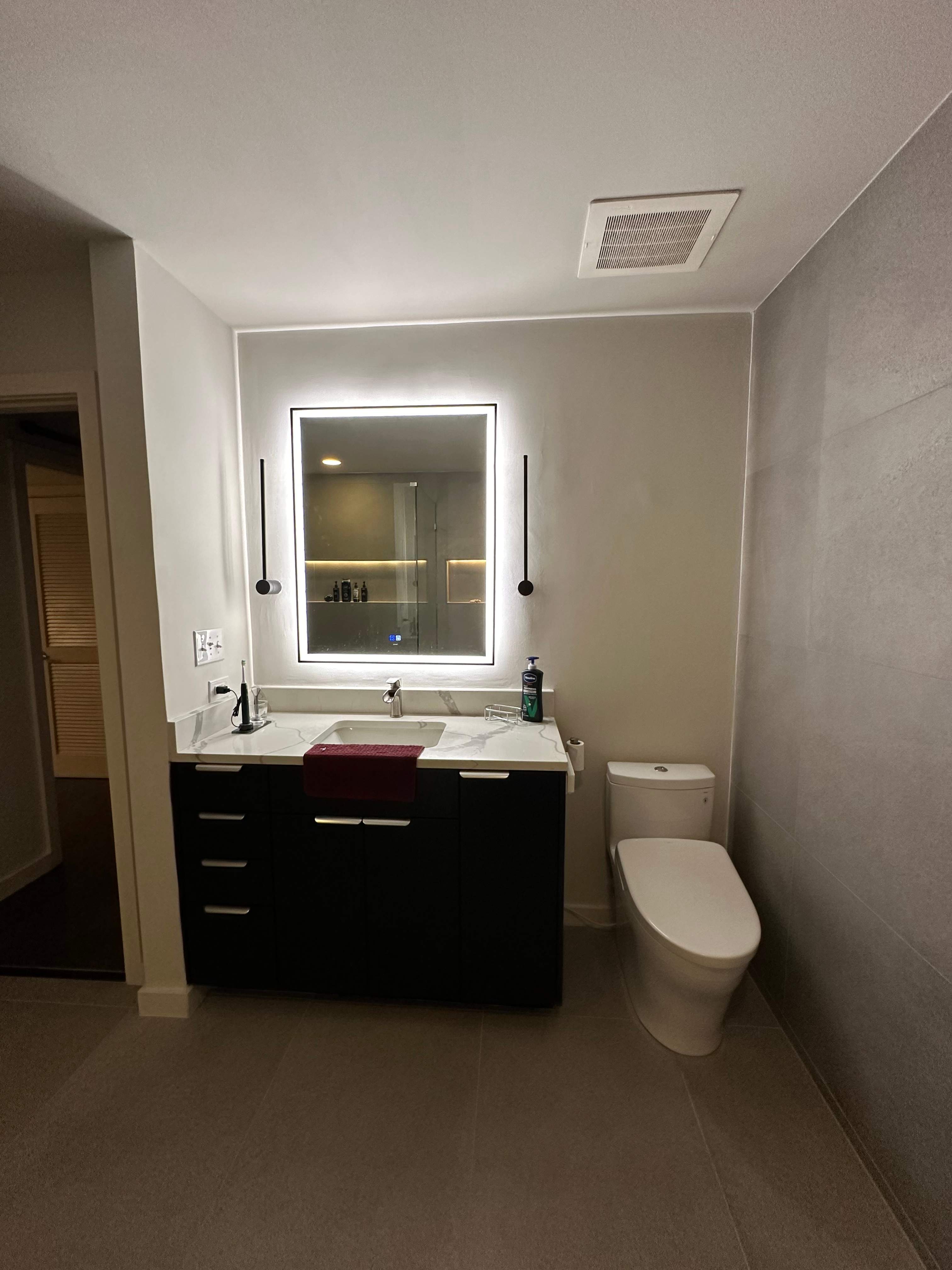 Modern Bathroom Transformation by Fine Line Flooring Inc.