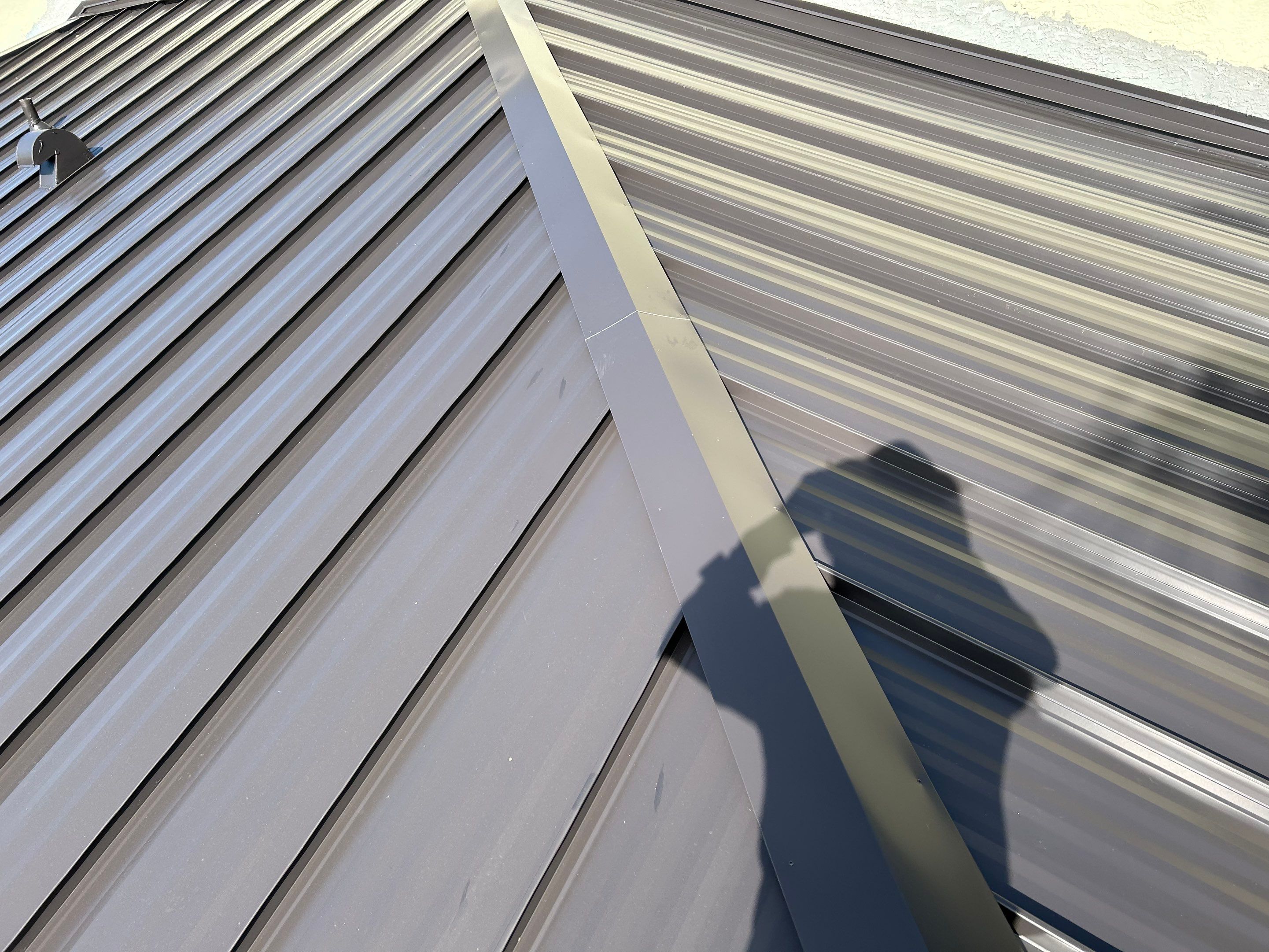 24ga 1.5" Mechanical Seam Dark Bronze by Total Roofing System The Metal Roof Experts