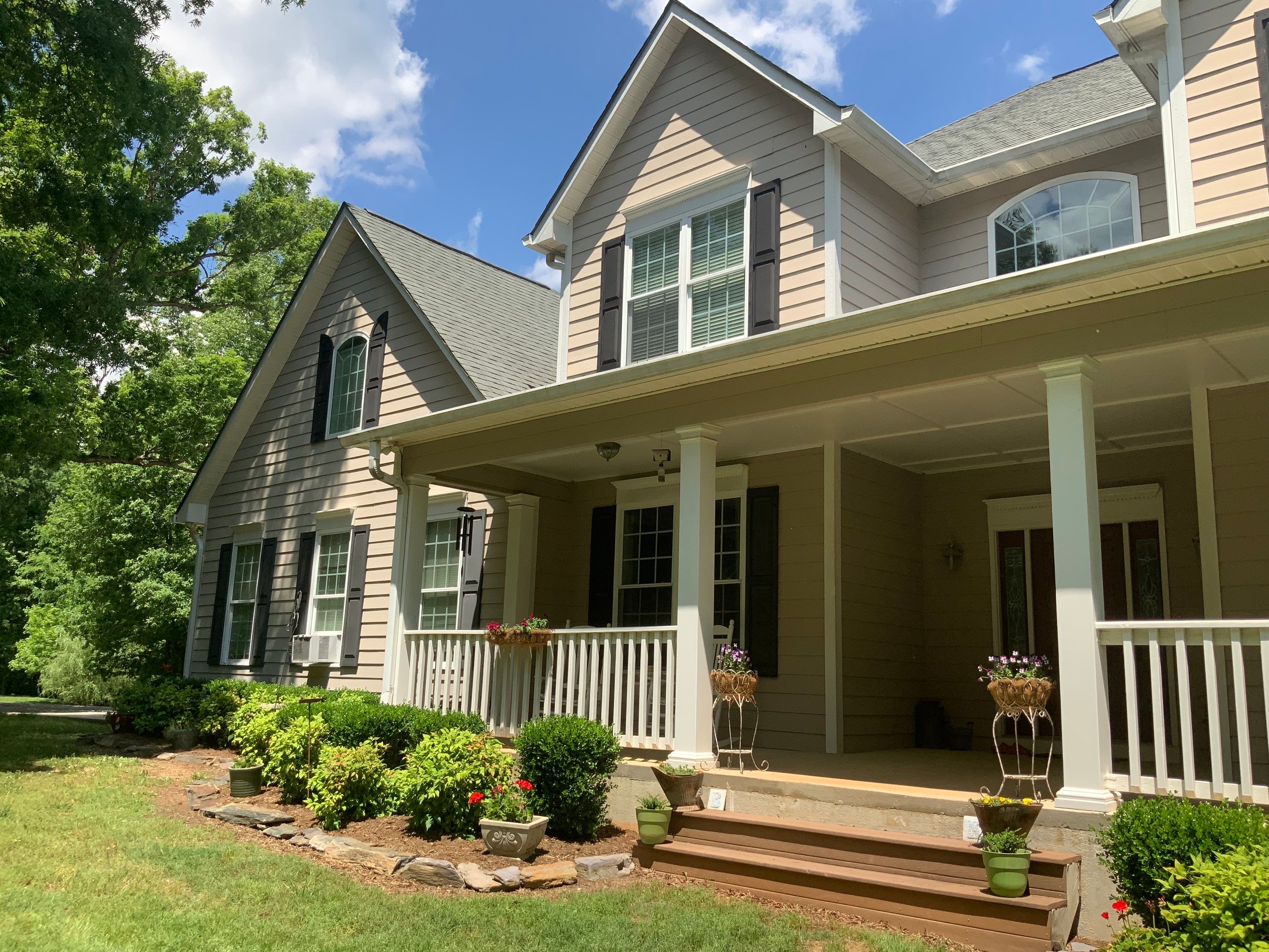 Siding replacement, exterior painting, and front door staining. by GonzalezPainters & Contractors Inc