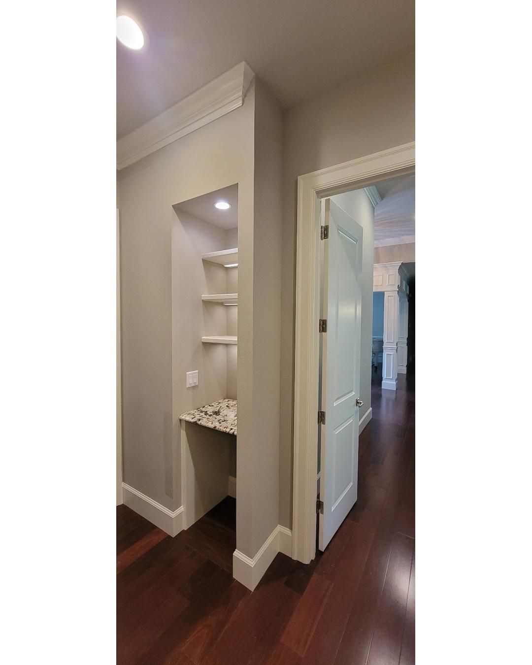 Closet transformation to coffee nook with custom shelves and LED lighting. by Crm Services Llc