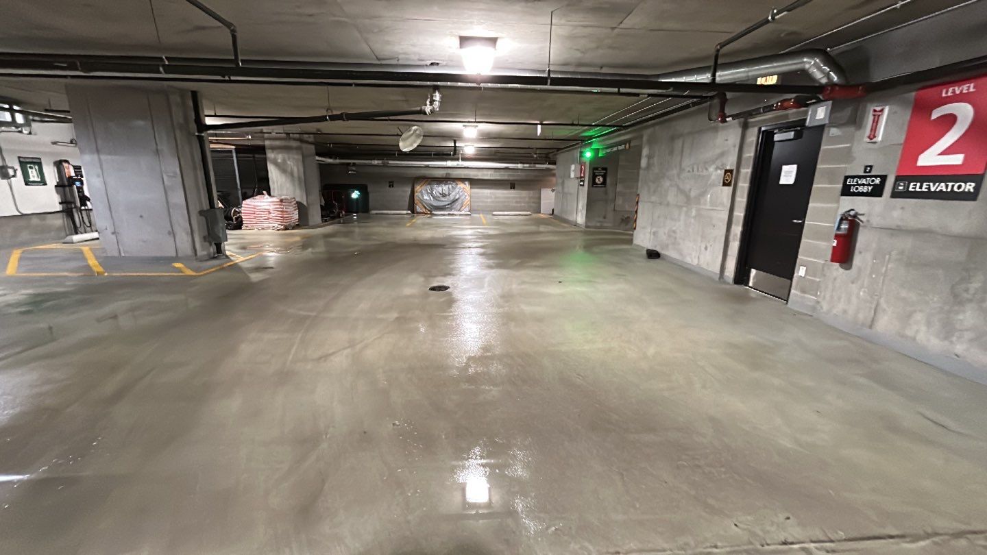 Parking garage using Hot water by Northern Power Washing LLC.