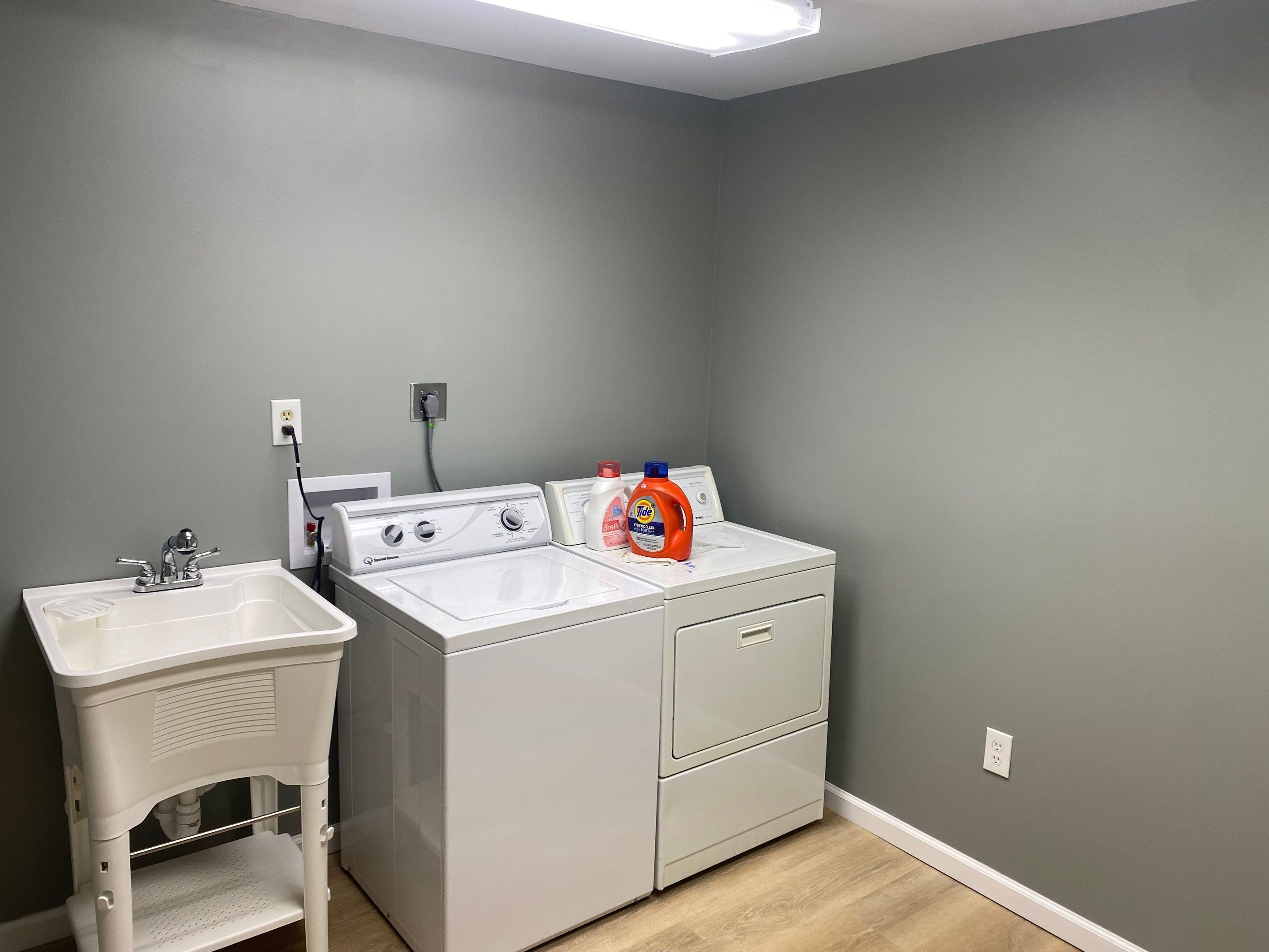 Laundry Room Redmodel using Lifeproof Luxury Vinyl Plank Flooring by The Smet Companies, LLC