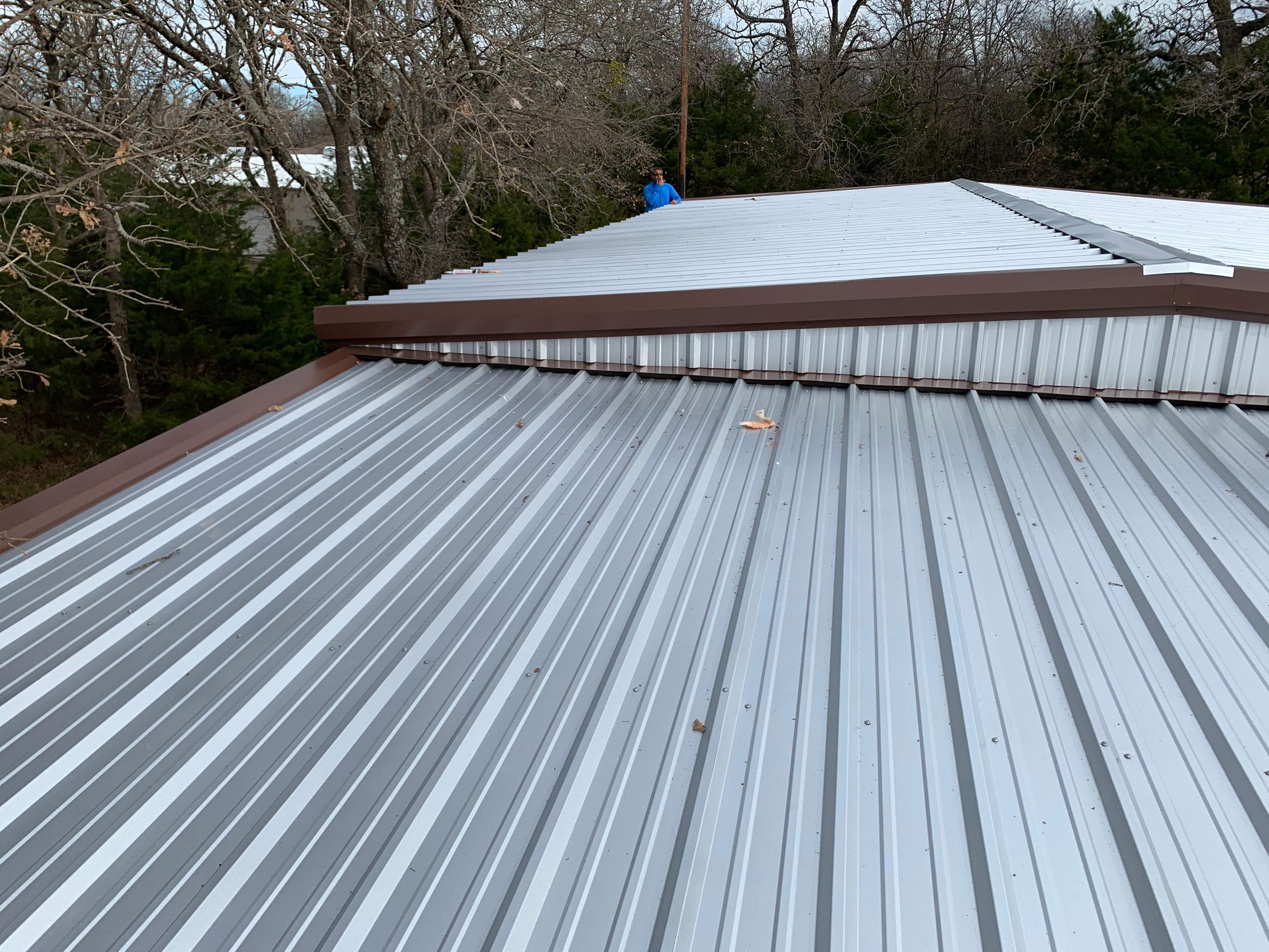 Install new R Panel Metal Roof at a Clients Farm house by First United Roofing & Construction