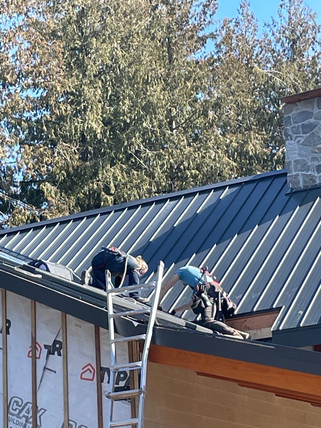 Residential Roofing Installation using 12" Prolok metal by Top Notch Roofing Inc