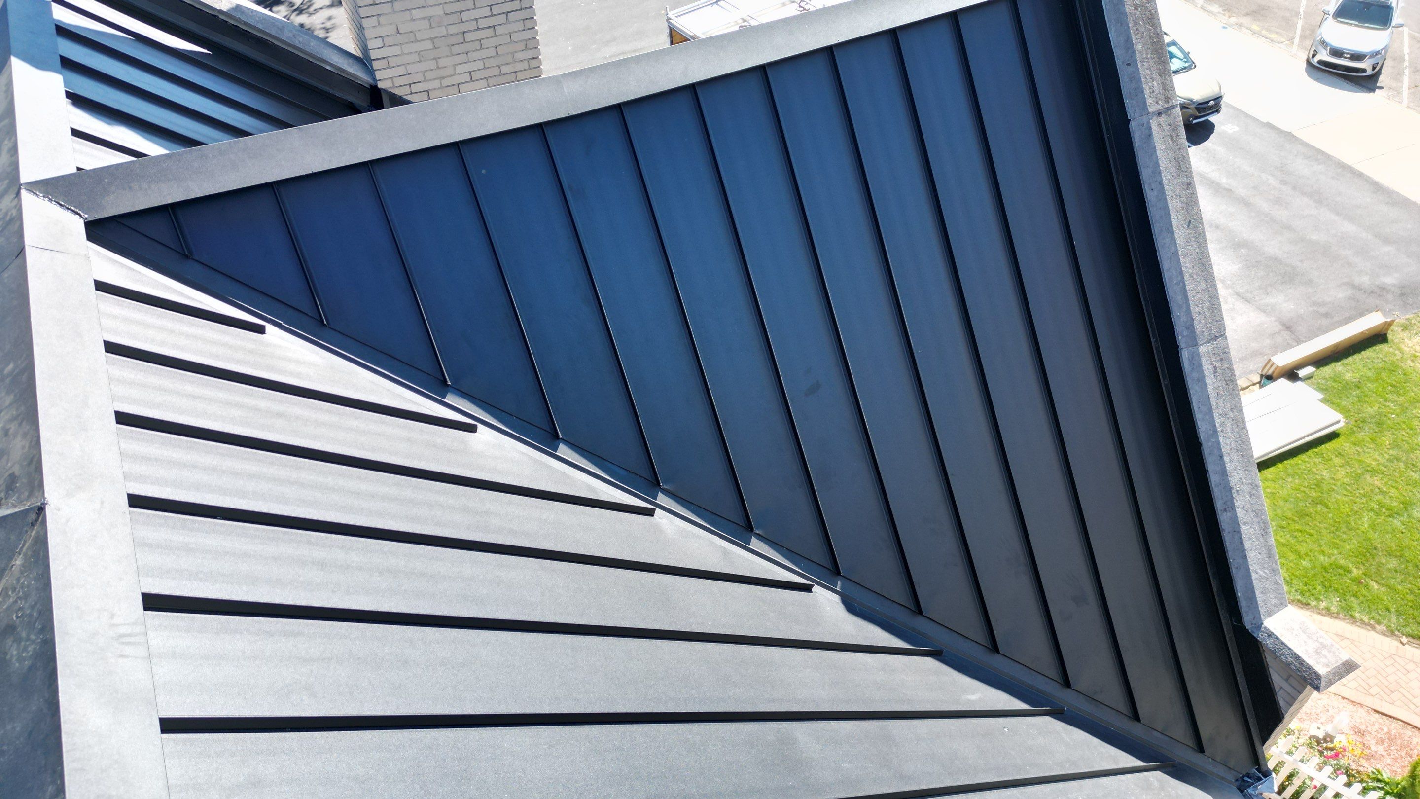 Commercial Roofing Installation using Standing Seam Metal - Frost Black by RoofX 