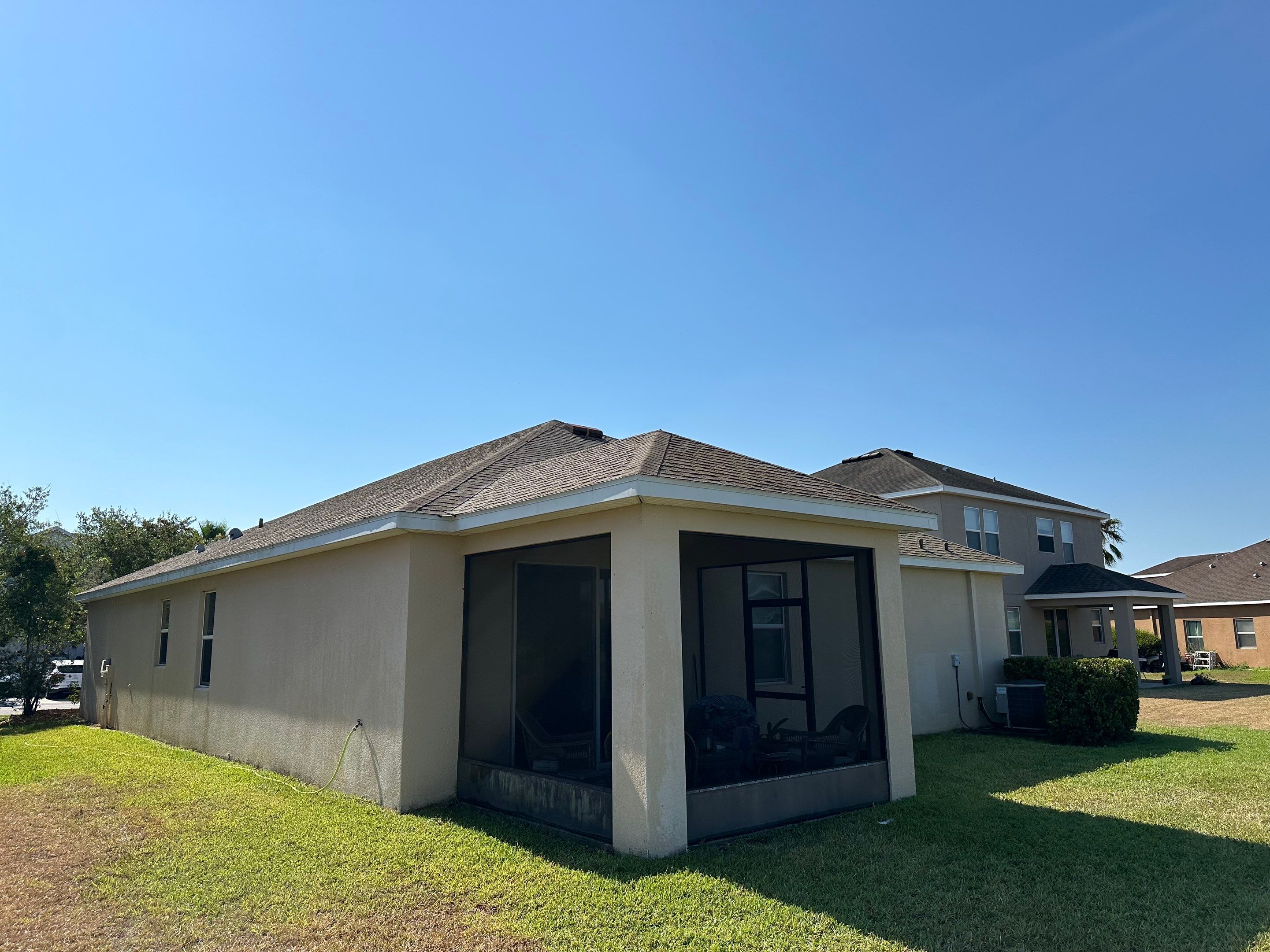 Asphalt Shingle Roof Soft Wash Cleaning & Concrete Pressure Washing in CopperStone Community, Parrish, FL by Sunshine AquaWash