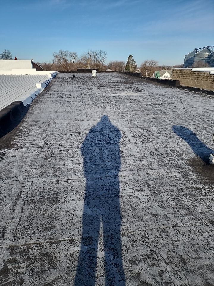 Recover of a downtown building  by Grell Roofing, LLC