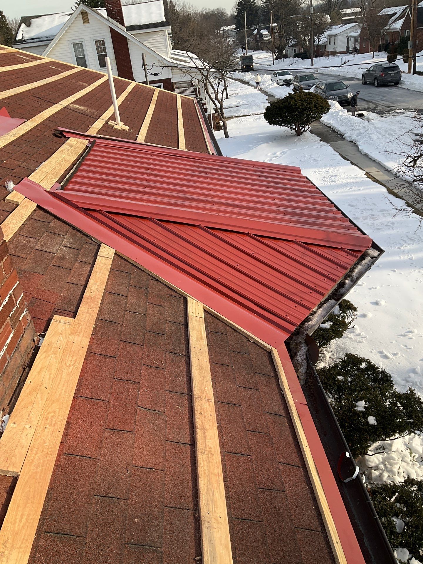 Red Metal Roofing Upgrade for Brick Home by Esh Builders
