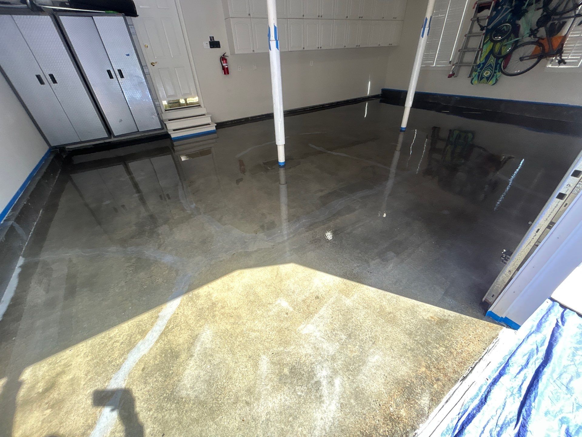 Concrete Floor Coating Transformation by DiGiorgi Roofing and Siding Inc