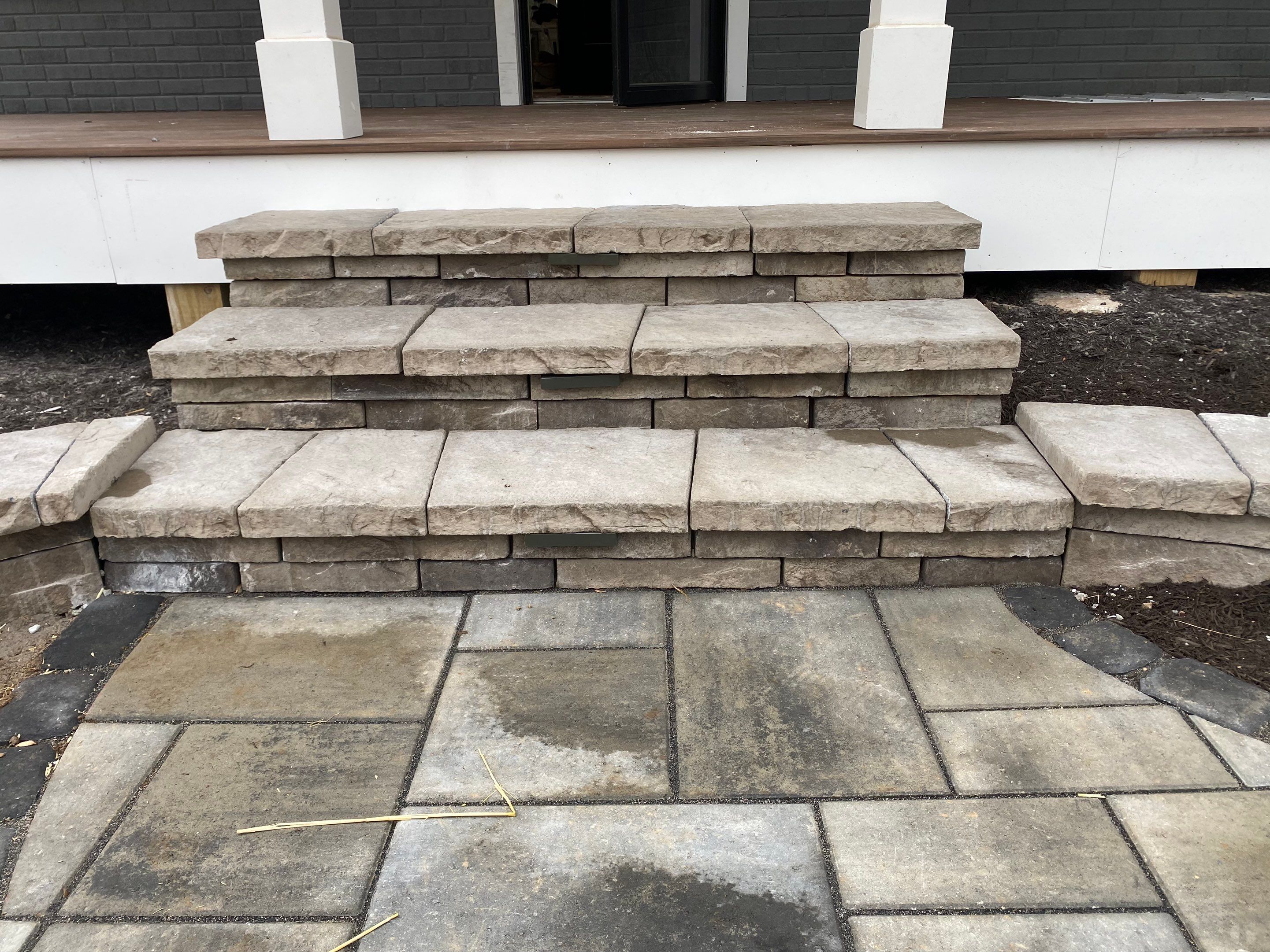Retaining wall, walkway, small patio and landscape install by The Smet Companies, LLC