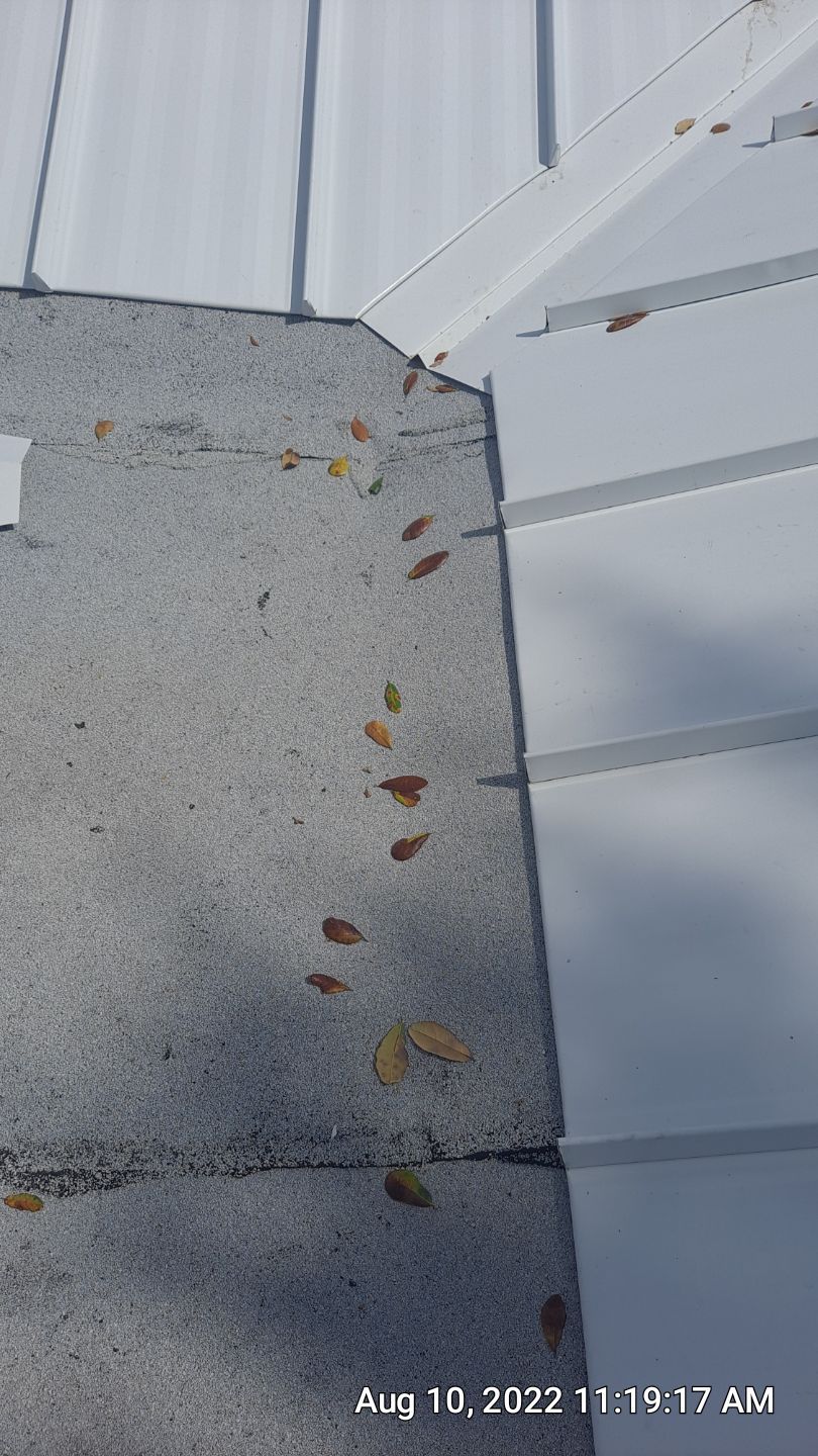 Residential Roofing Installation using 1.5" Nail Strip 24ga Solar White Kynar Coated Standing Seam Metal Panels by Morton Roofing, Inc.