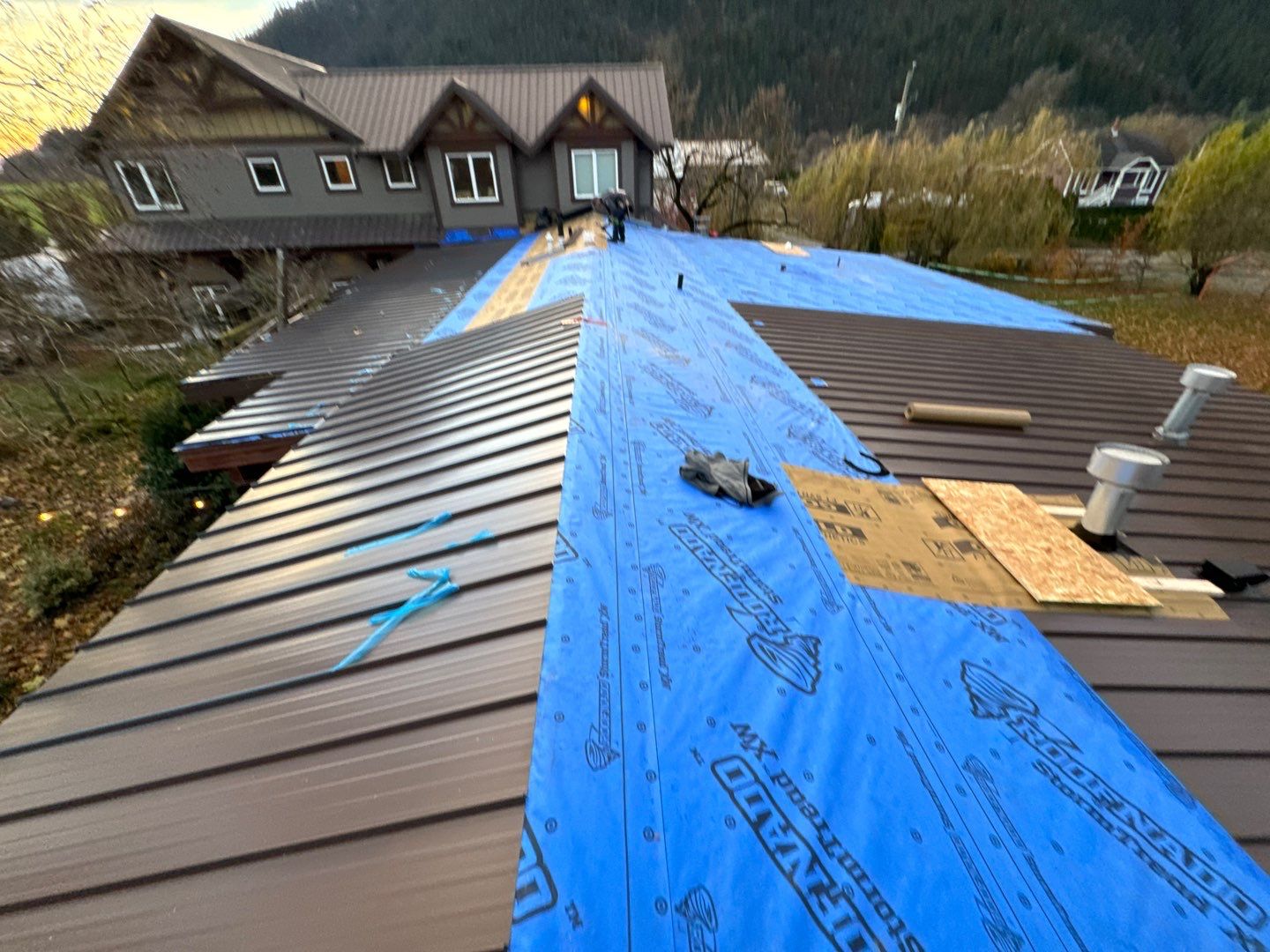 Residential Roofing Installation using 12" Prolok metal  by Top Notch Roofing Inc