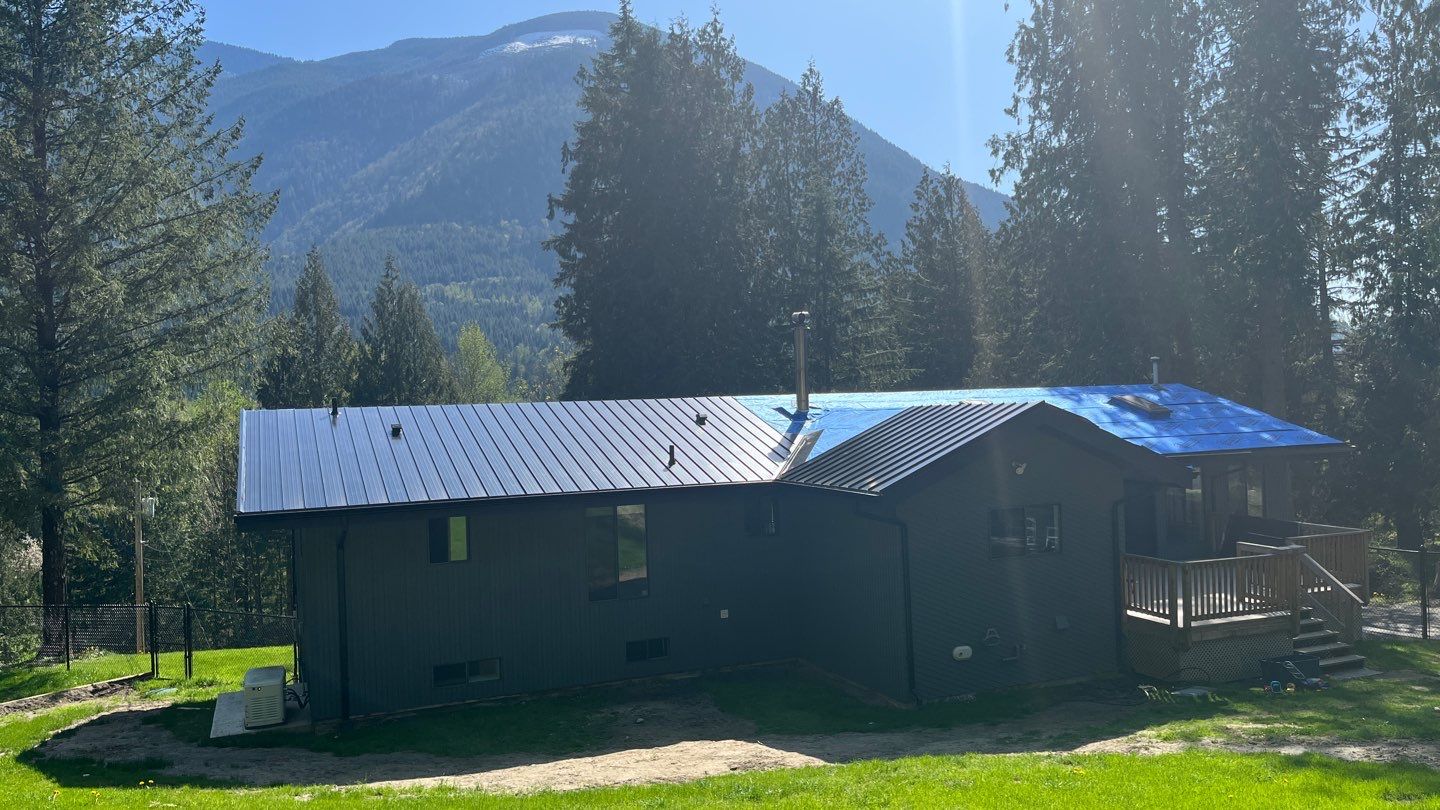 Residential ReRoofing Installation using 12" Prolok metal by Top Notch Roofing Inc