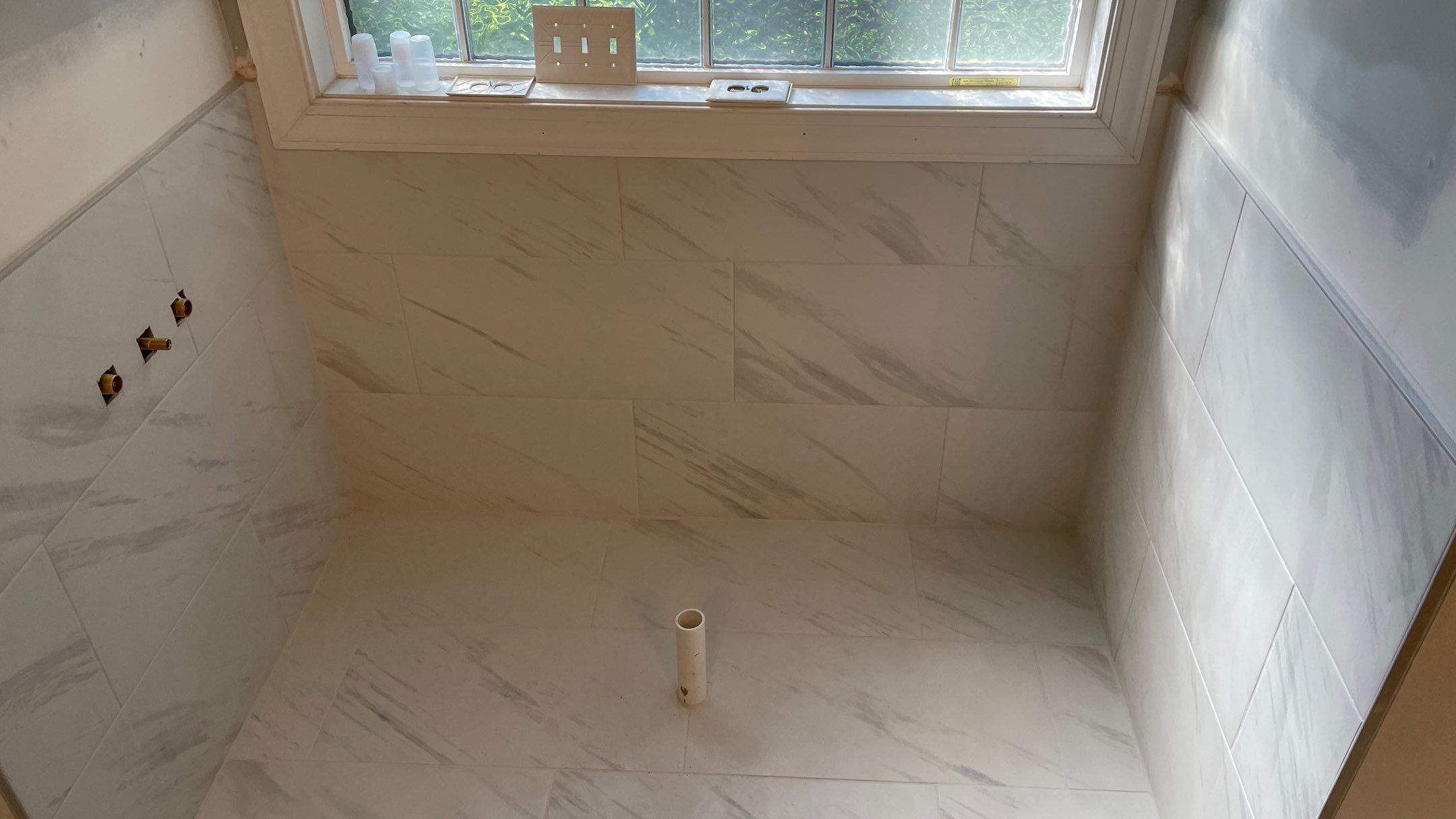 Bright Bathroom Remodel with Wall Removal, Stand Alone Tub and New Vanity by Footprints Floors of Coastal Carolina