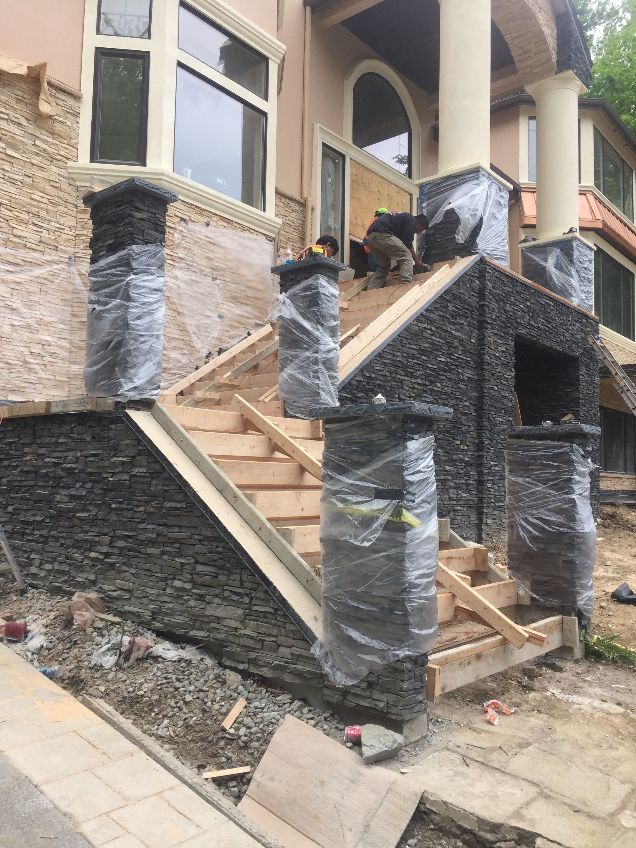 Asphalt Driveway and Stamped Concrete Patio Finish  by Jireh Asphalt & Concrete Inc 