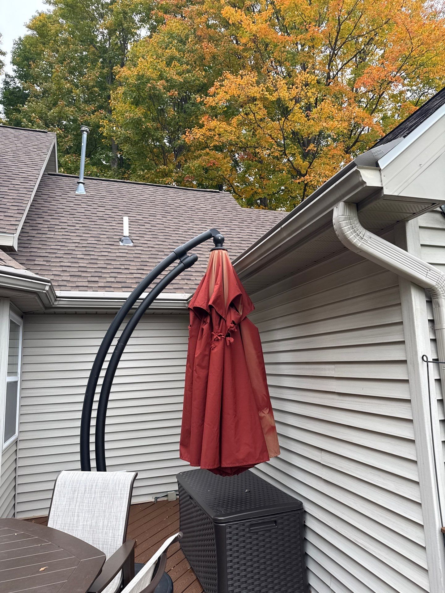 Traverse City Gutter Helmet Installation on a Shingled Roof Home by Rainbow Seamless Systems