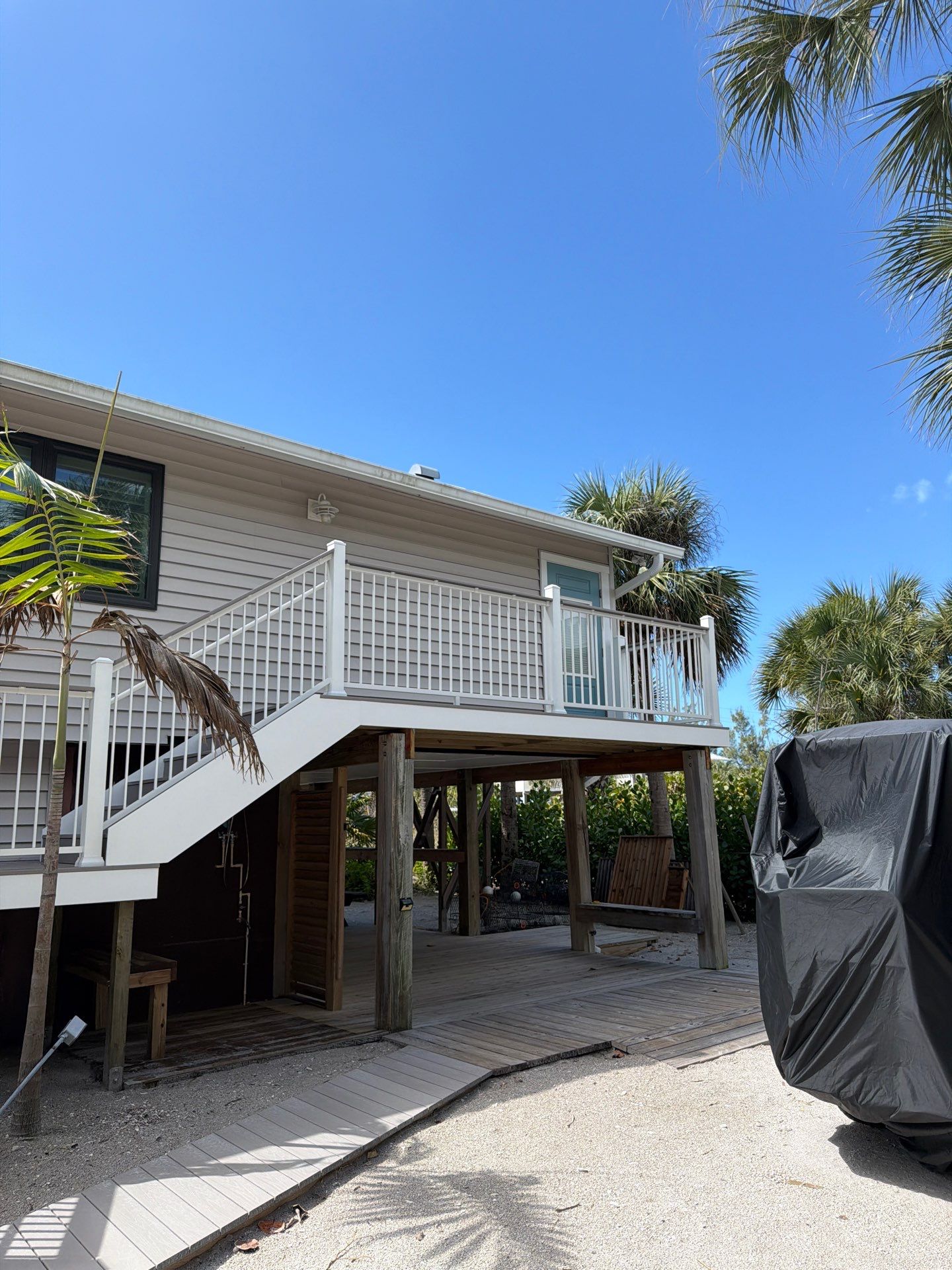 Elevated Deck and Composite Staircase Replacement in Placida Florida by Smirnov Construction Inc