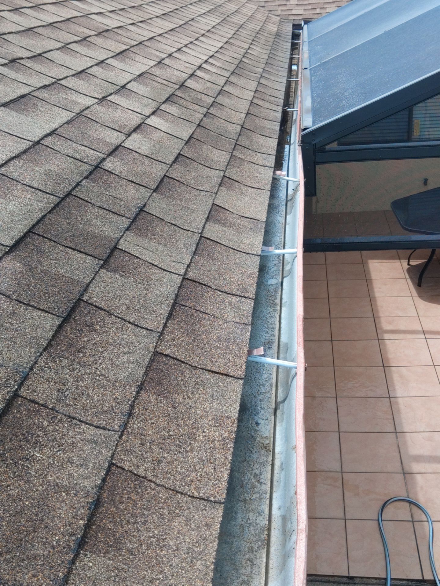 Gutter cleaning in Sarasota, FL is essential for keeping your drainage system working properly by Gutter Professors