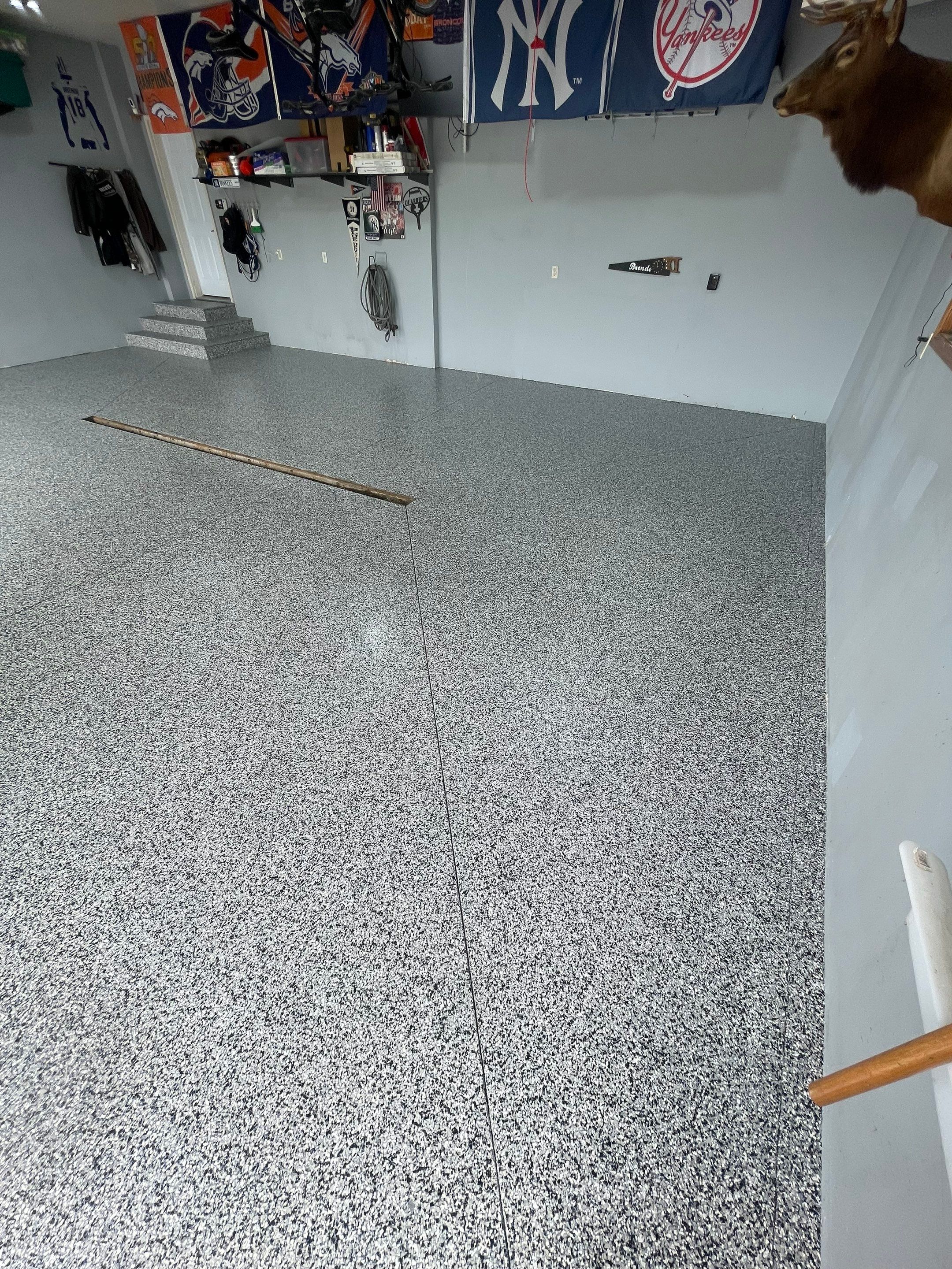 Full Garage Floor Epoxy Coating Installation in Dell Rapids by Select Painting, Coatings & Garage Cabinets