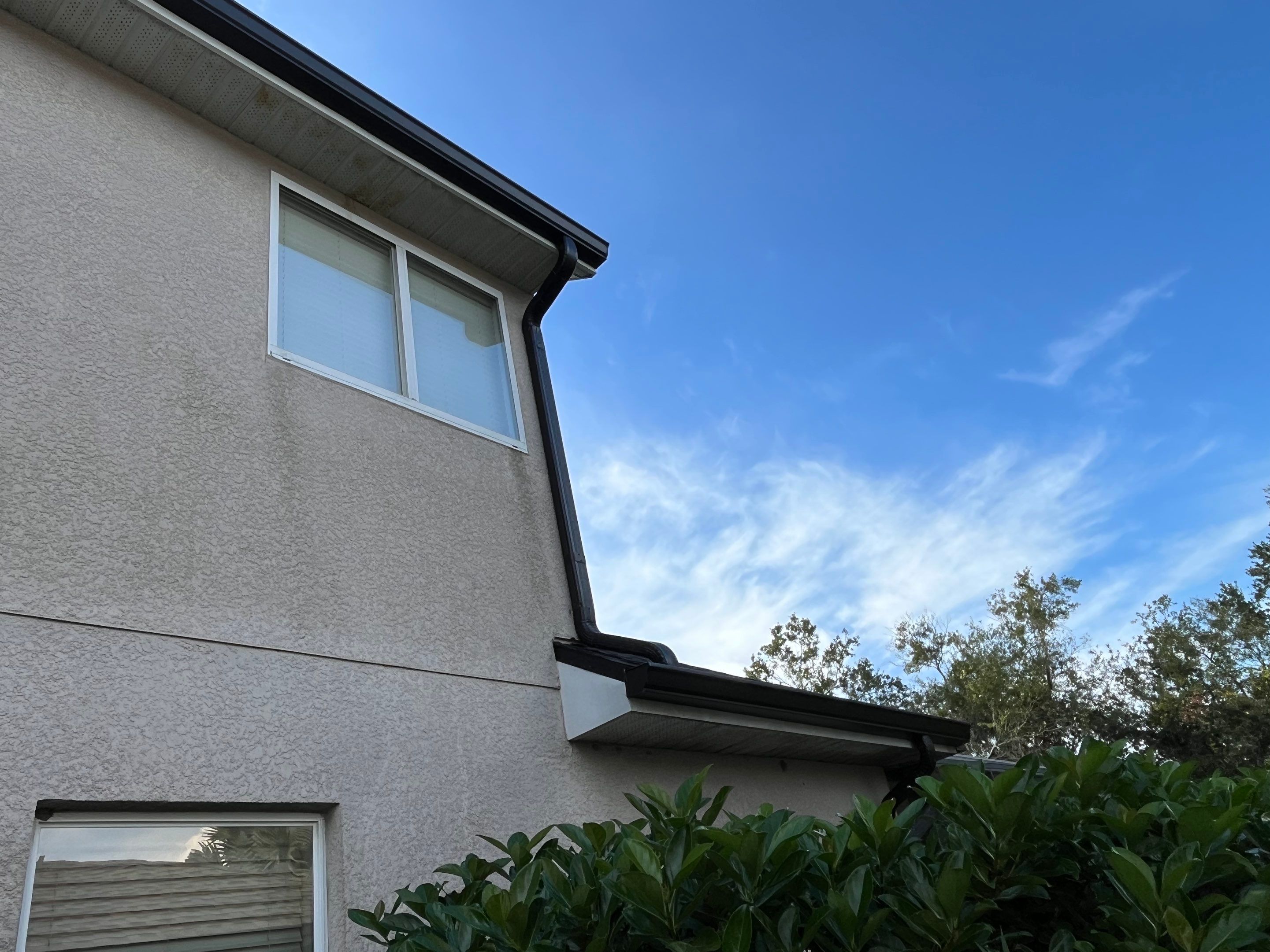 Black 6-inch Seamless Gutters for Modern Ellenton Homes FL by Gutter Professors