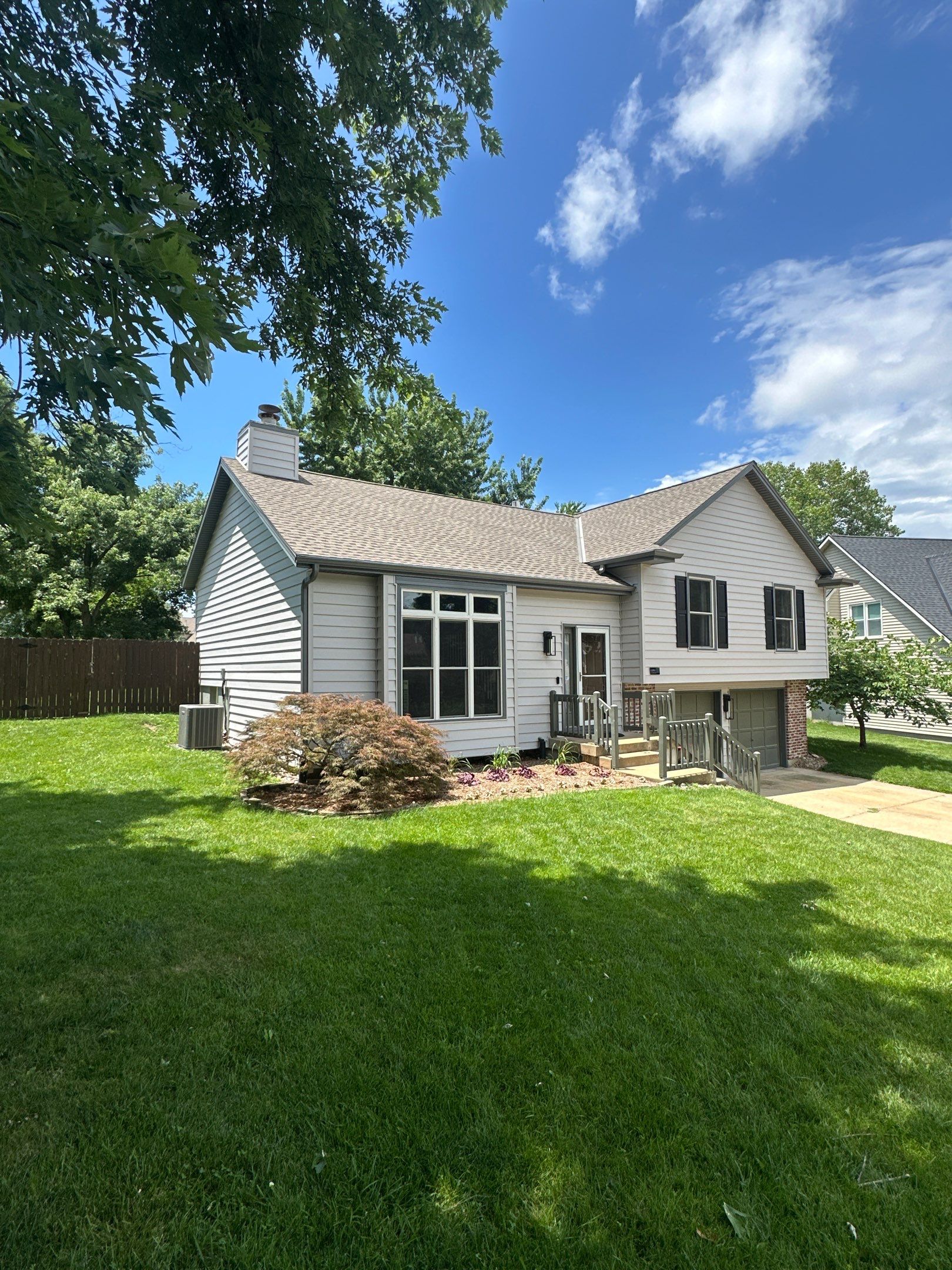 Whole-Home Craneboard Siding Replacement and Exterior Renovation in Shawnee by EEC Windows, Siding & Roofing