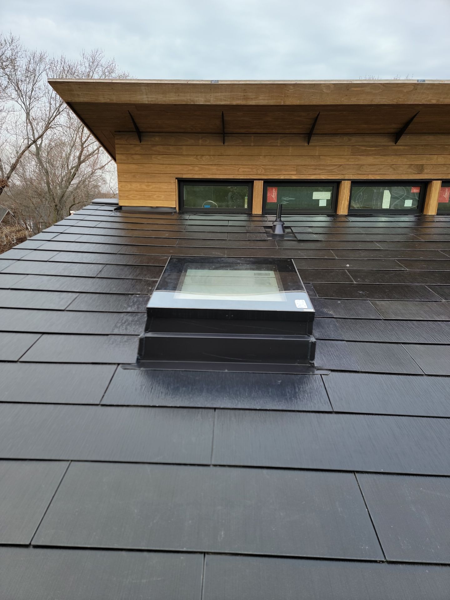 Tesla Solar Roof using SPAN smart electrical panel by American Home Contractors