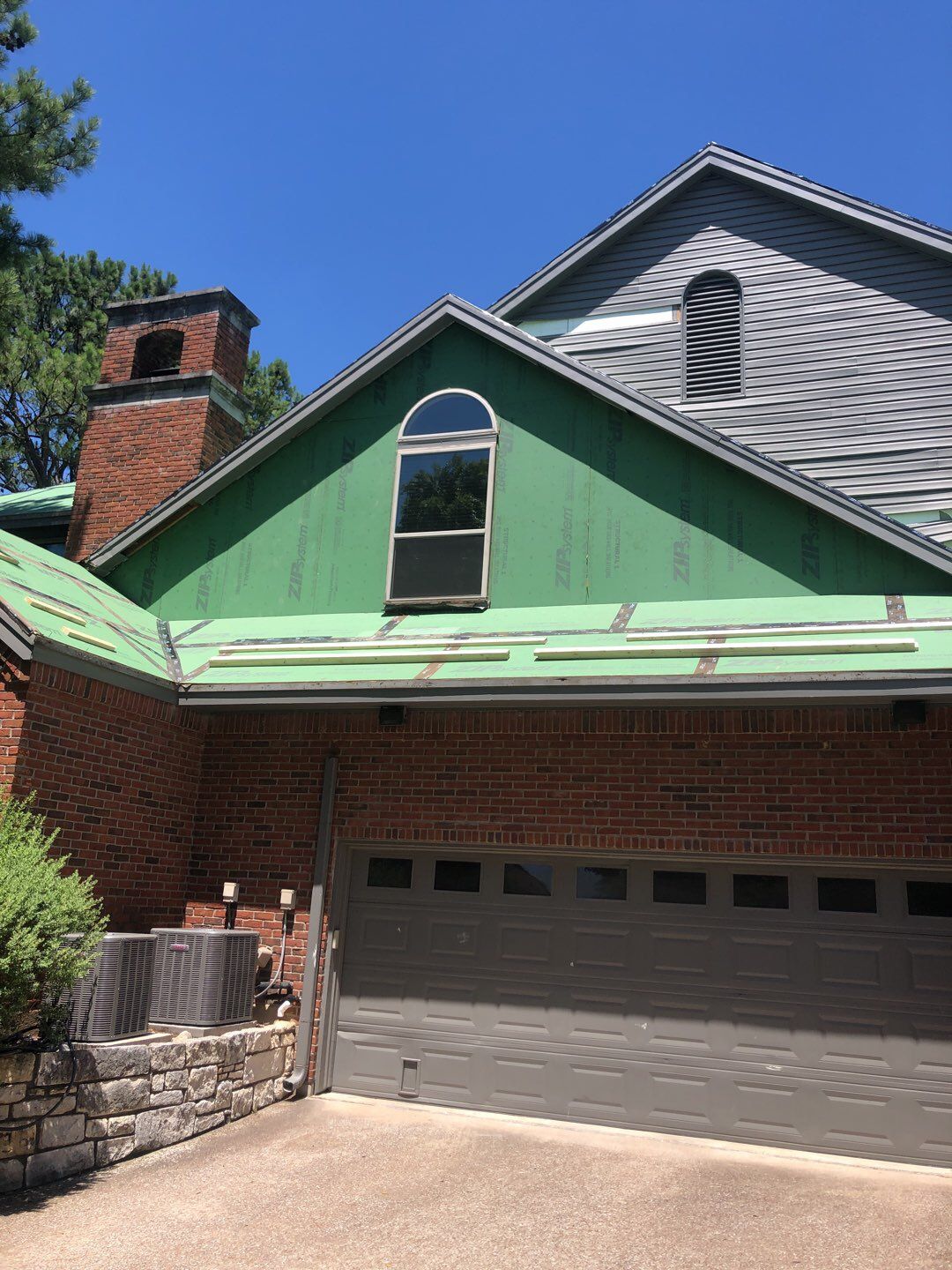 Designer Residential Roof with Zip System by Springtree Restoration