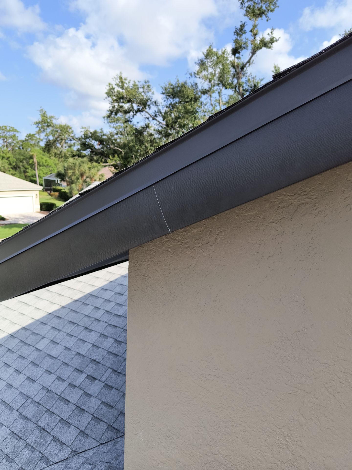 Black Seamless Gutters in Sarasota FL by Gutter Professors