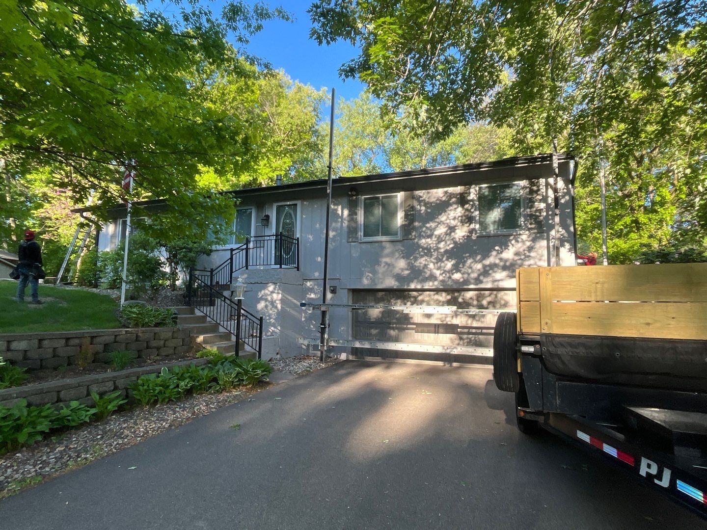Premium Exterior Remodel – Alside Charter Oak Siding, Hayfield Black Frame Windows, Edco Soffit & Fascia by First Impressions Exteriors