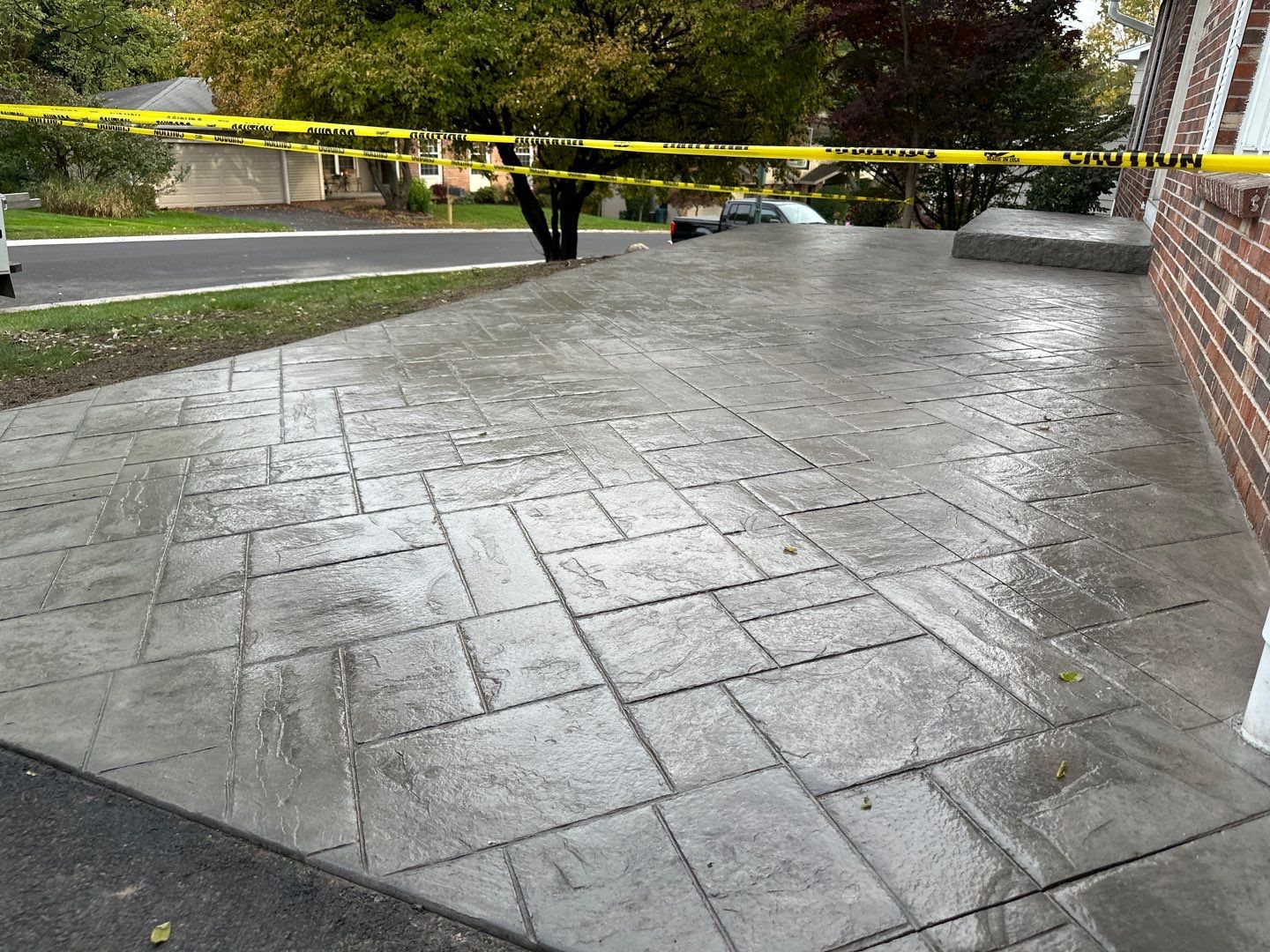 Ashlar slate stamped concrete patio  by NG Masonry & Construction LLC