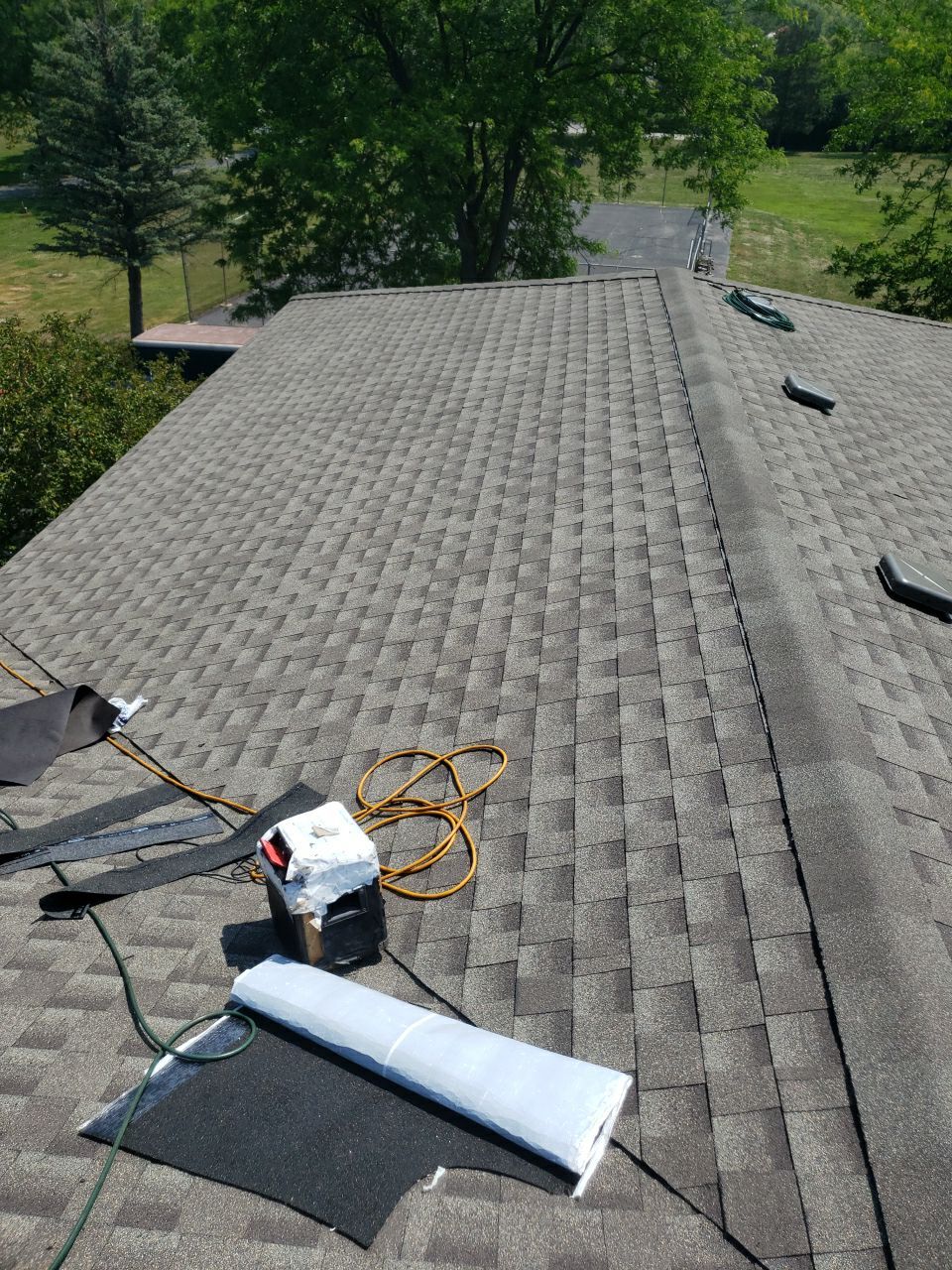 Asphalt Roof Replacement and Aluminum Gutter Installation by Custom Installations
