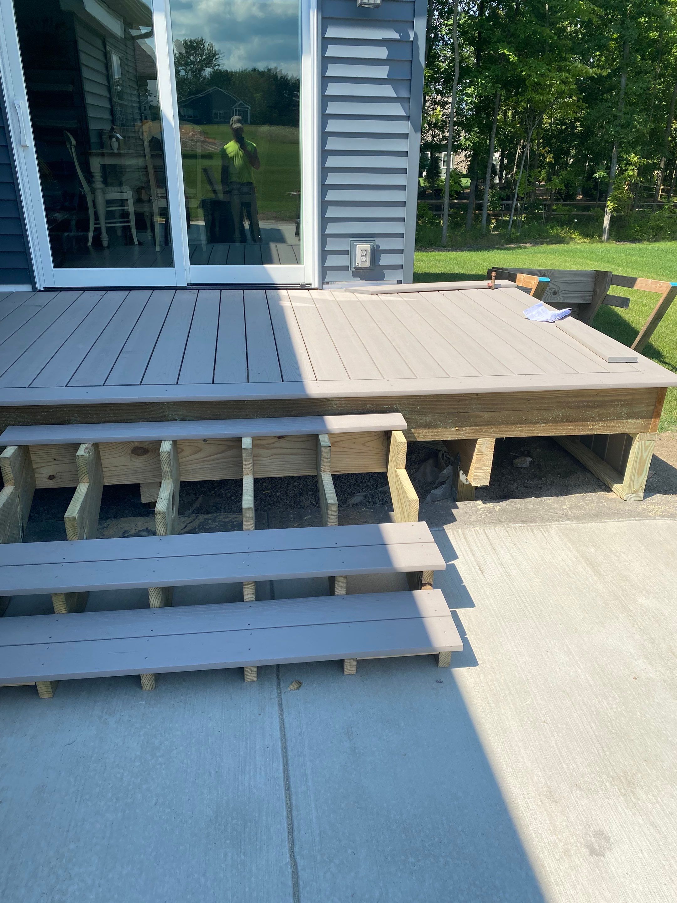 Outdoor Living- Deck and Concrete by Ivy Lea Construction