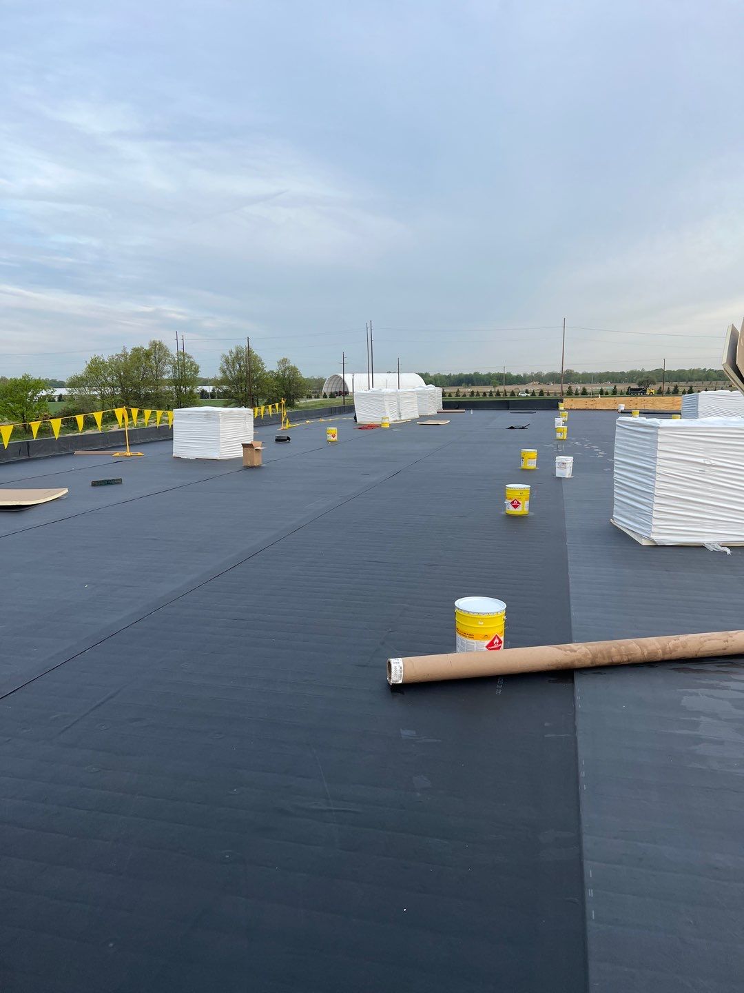 Commercial Roofing Installation using 60 mil rubber roof  by Nitro Roofing and Construction