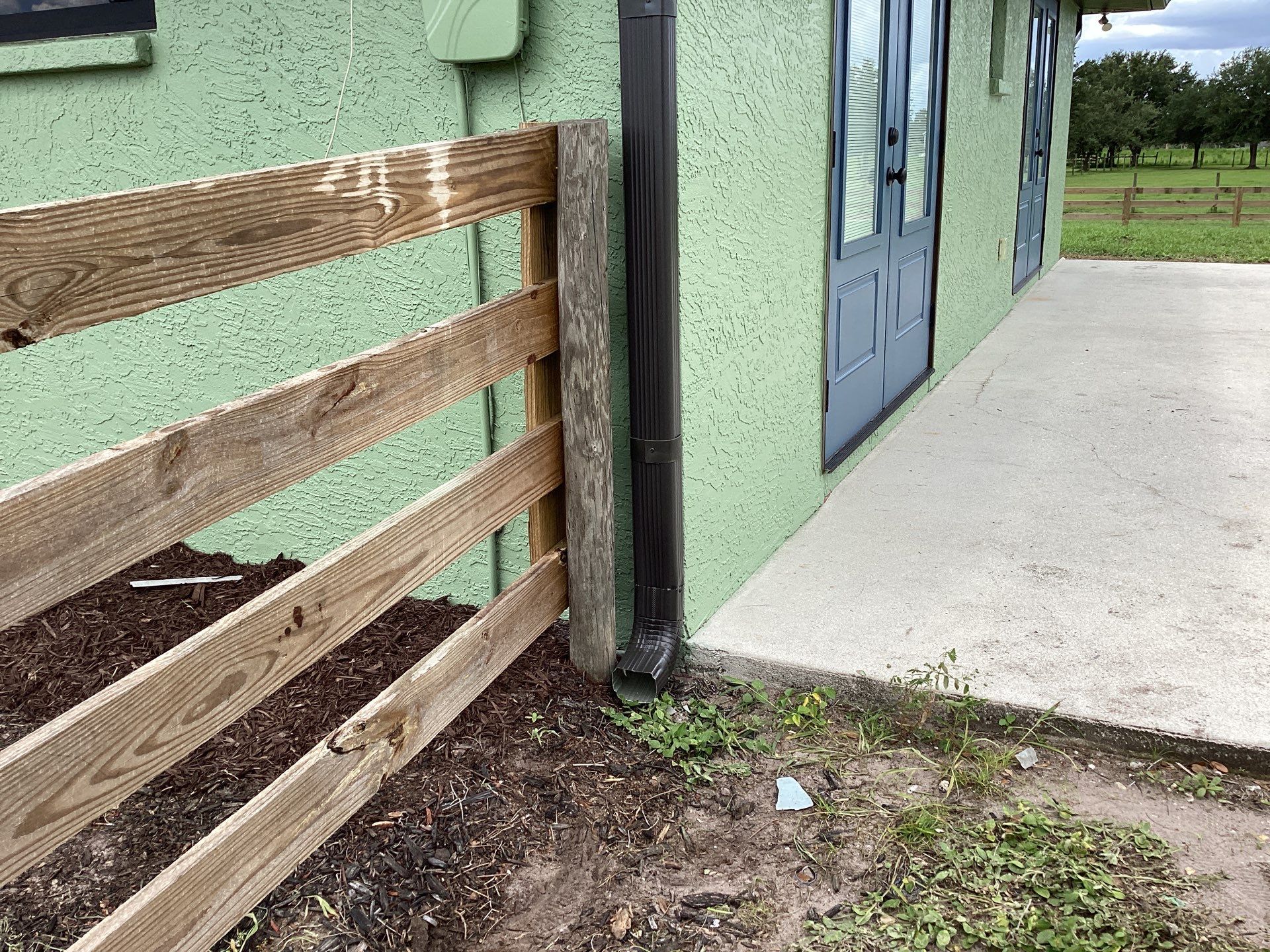 Musket brown downspouts with 6-inch K-Style gutter installation in Myakka City, FL by Gutter Professors