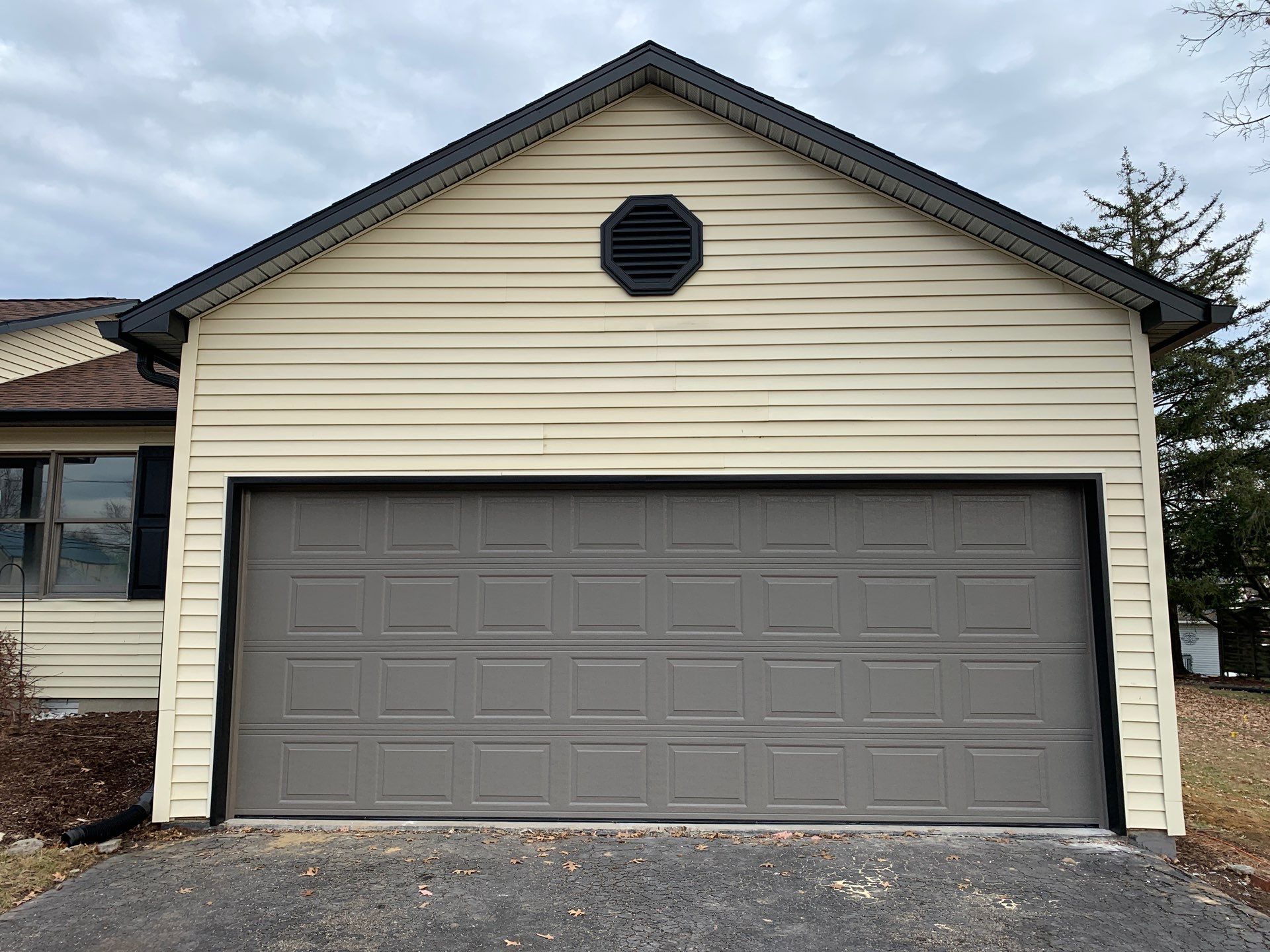 New Black Gutters, Post Wrap, and Garage Wrap by Storm Contracting 