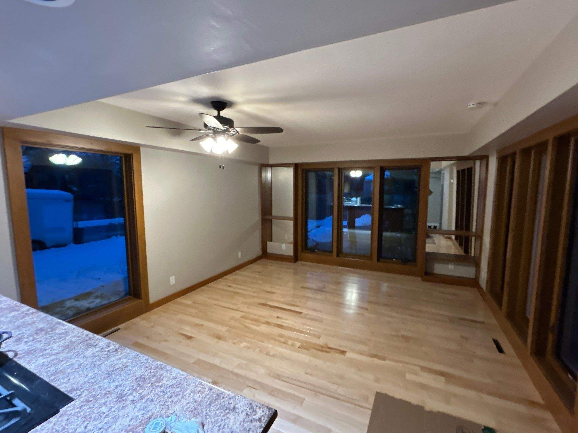 Black-Frame Pella Lifestyle Upgrade on a Partial Brick Home by United Windows and Siding LLC