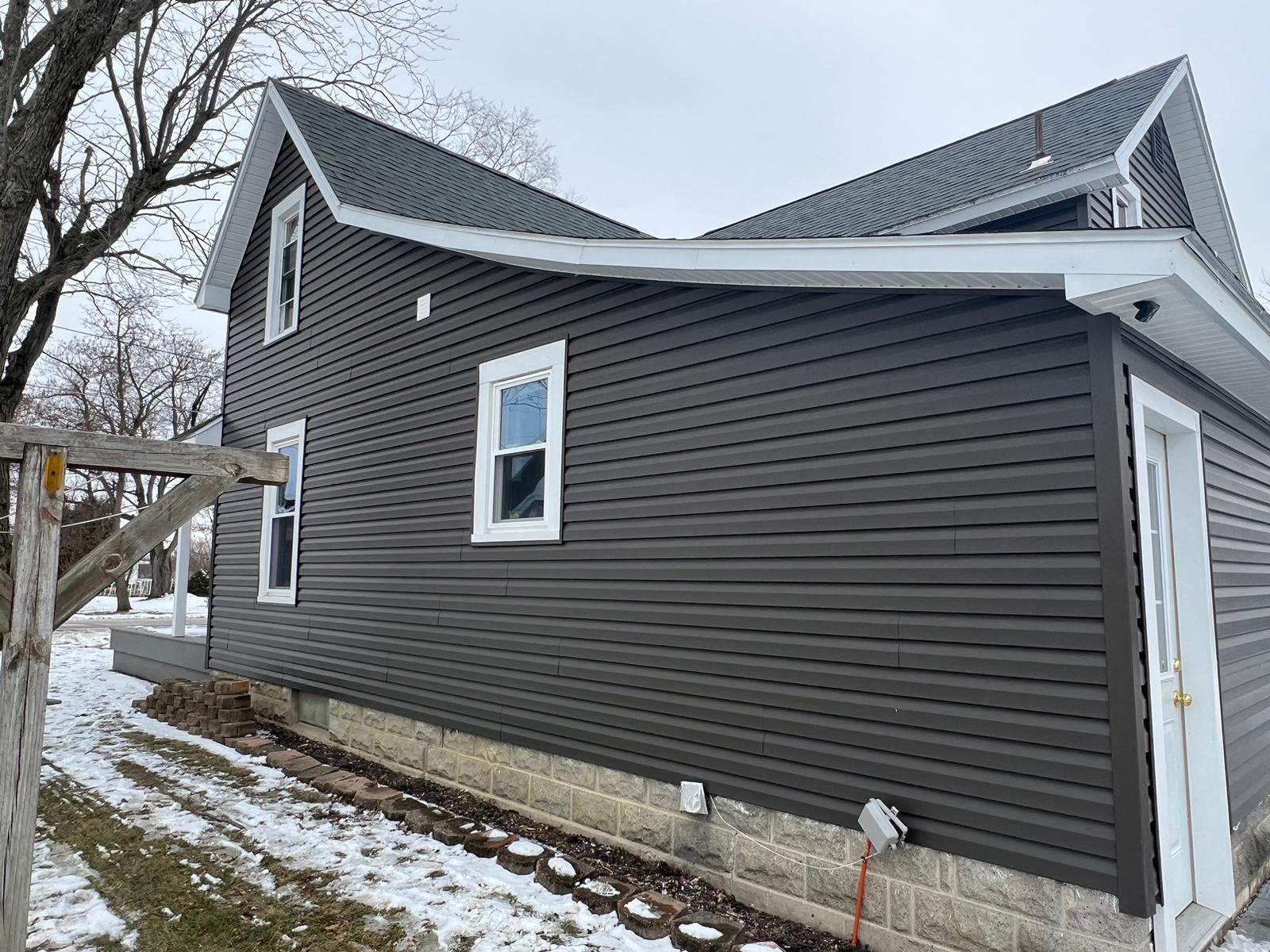 Residential fascia replacement using Exterior Portfolio 4.5 DL - Peppercorn by Nitro Roofing and Construction