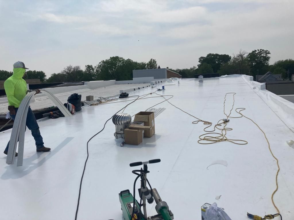 Recover of a downtown building  by Grell Roofing