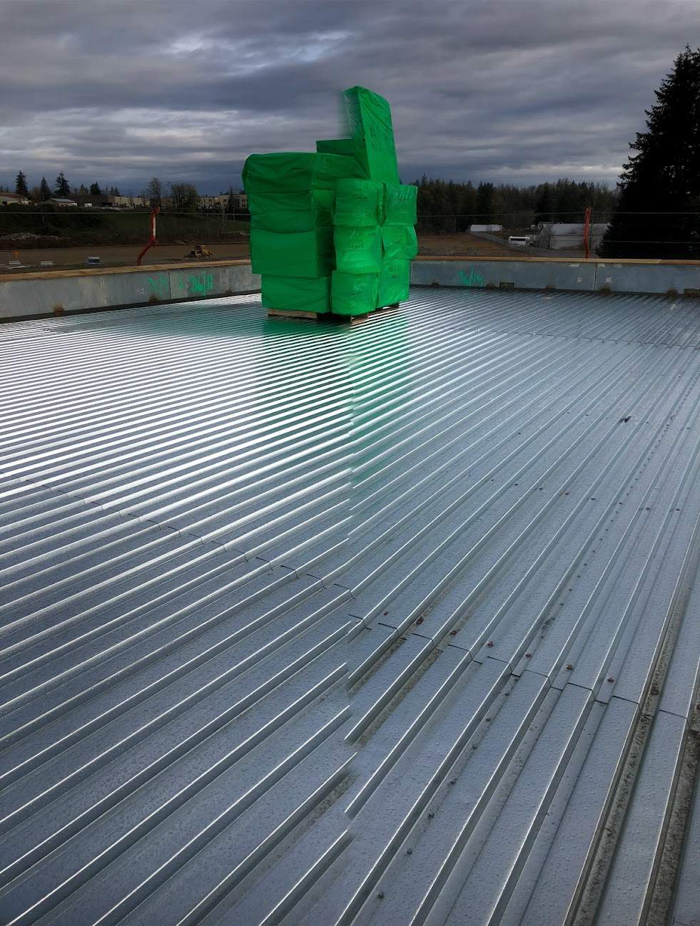 Commercial Roofing Installation using EPDM loose lay with balast by Top Notch Roofing Inc
