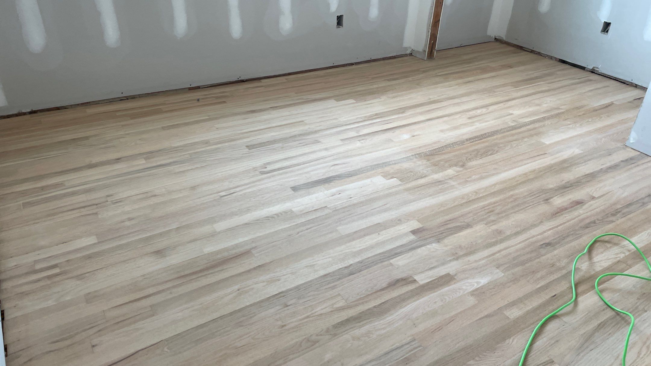 Remodeled Home with new tile floors, Showers and Refinished Oak Floors with stain and Waterbased Finish by Footprints Floors of Coastal Carolina