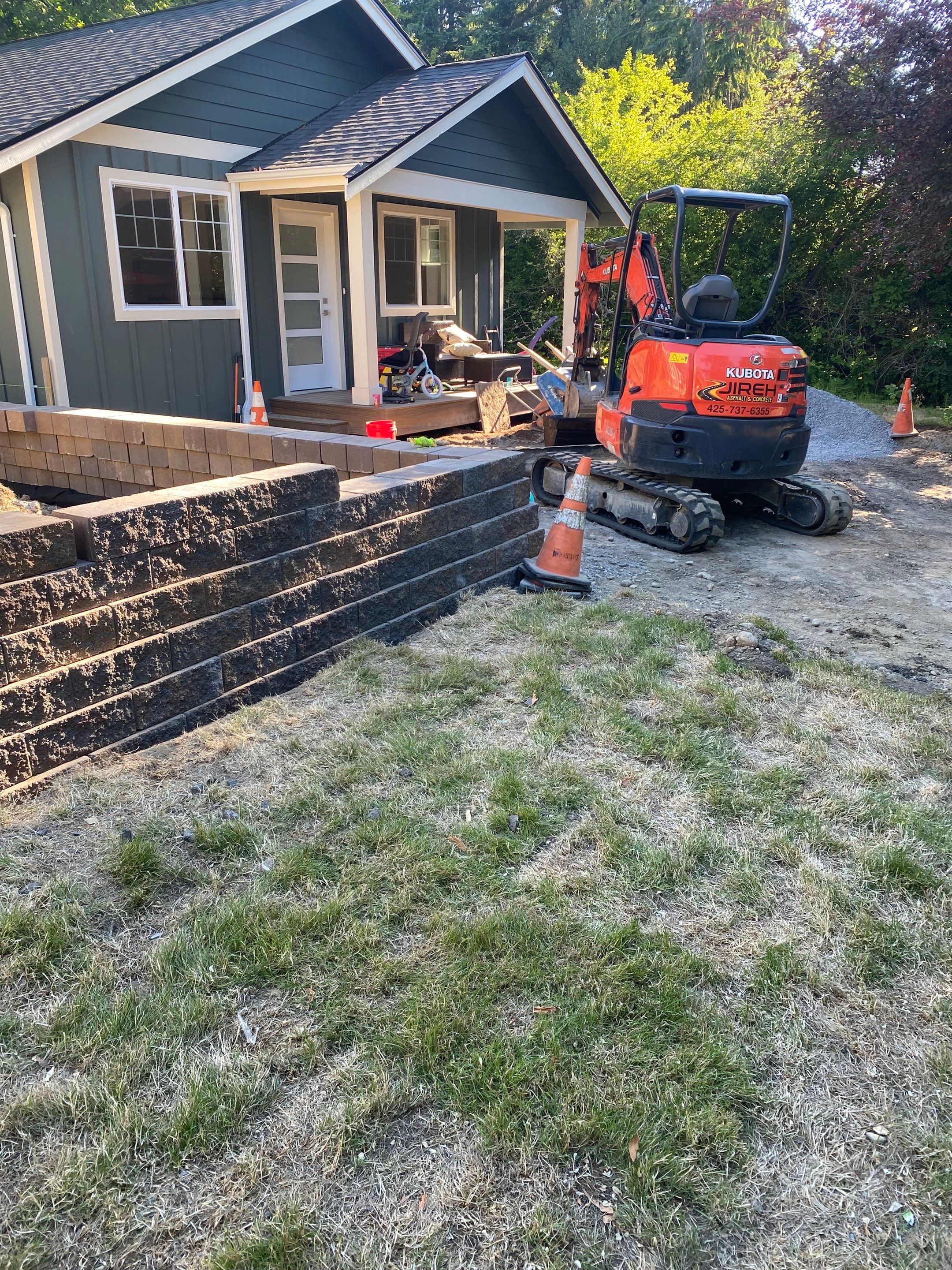 Patio Installation using Concrete, Retaining walls, and Turf install by Jireh Asphalt & Concrete Inc 