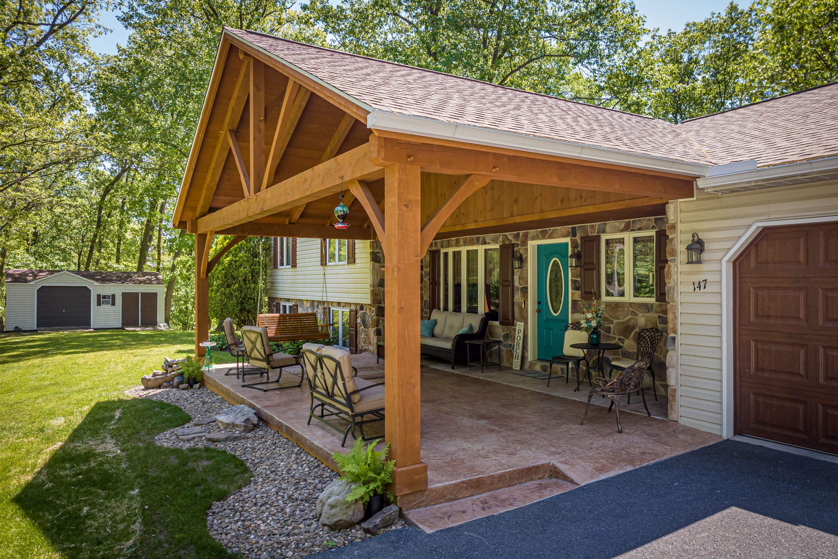 Reshingle-shakewood and timberframe patio roof by Esh Builders
