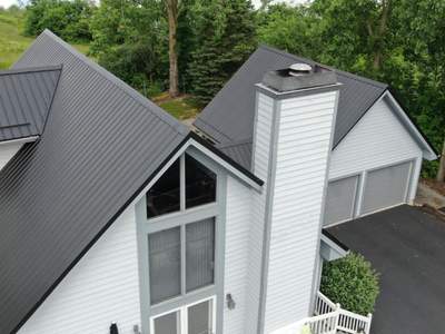Residential Roofing Installation using Exposed Fastener Metal Roof