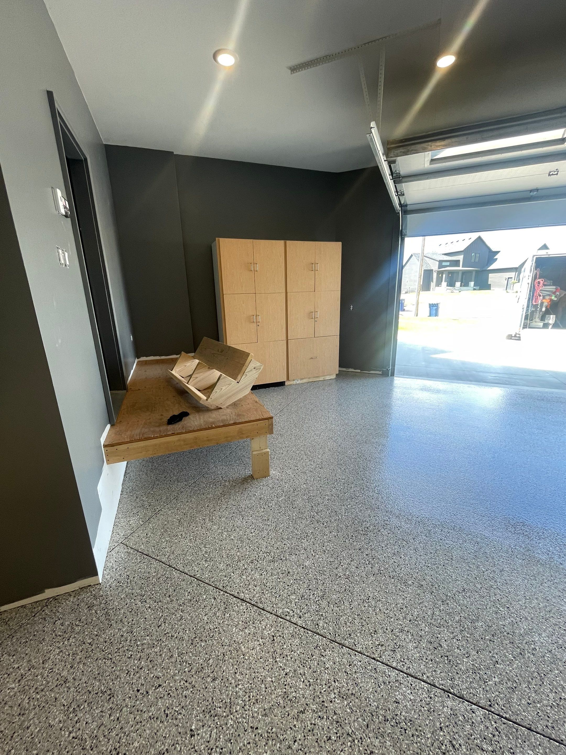 Custom Speckled Concrete Coating for Dell Rapids Garage by Select Painting, Coatings & Garage Cabinets